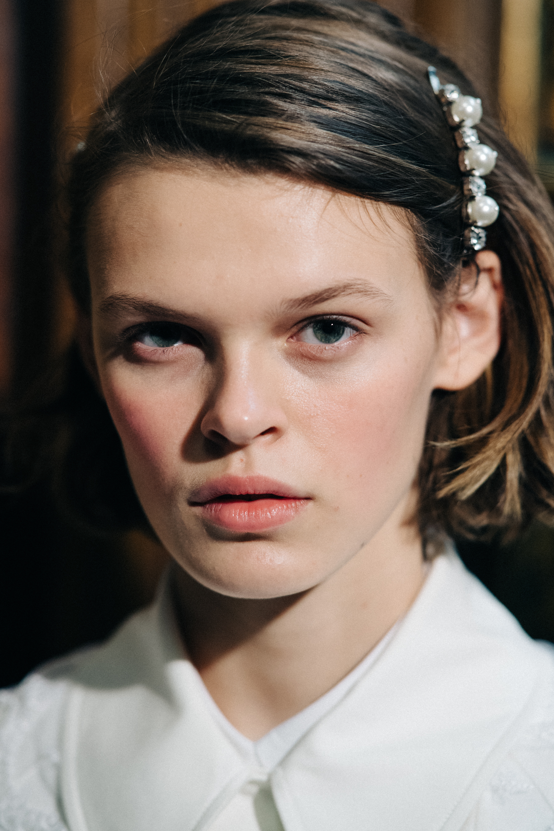 Model wearing pearl encrusted hair decorations