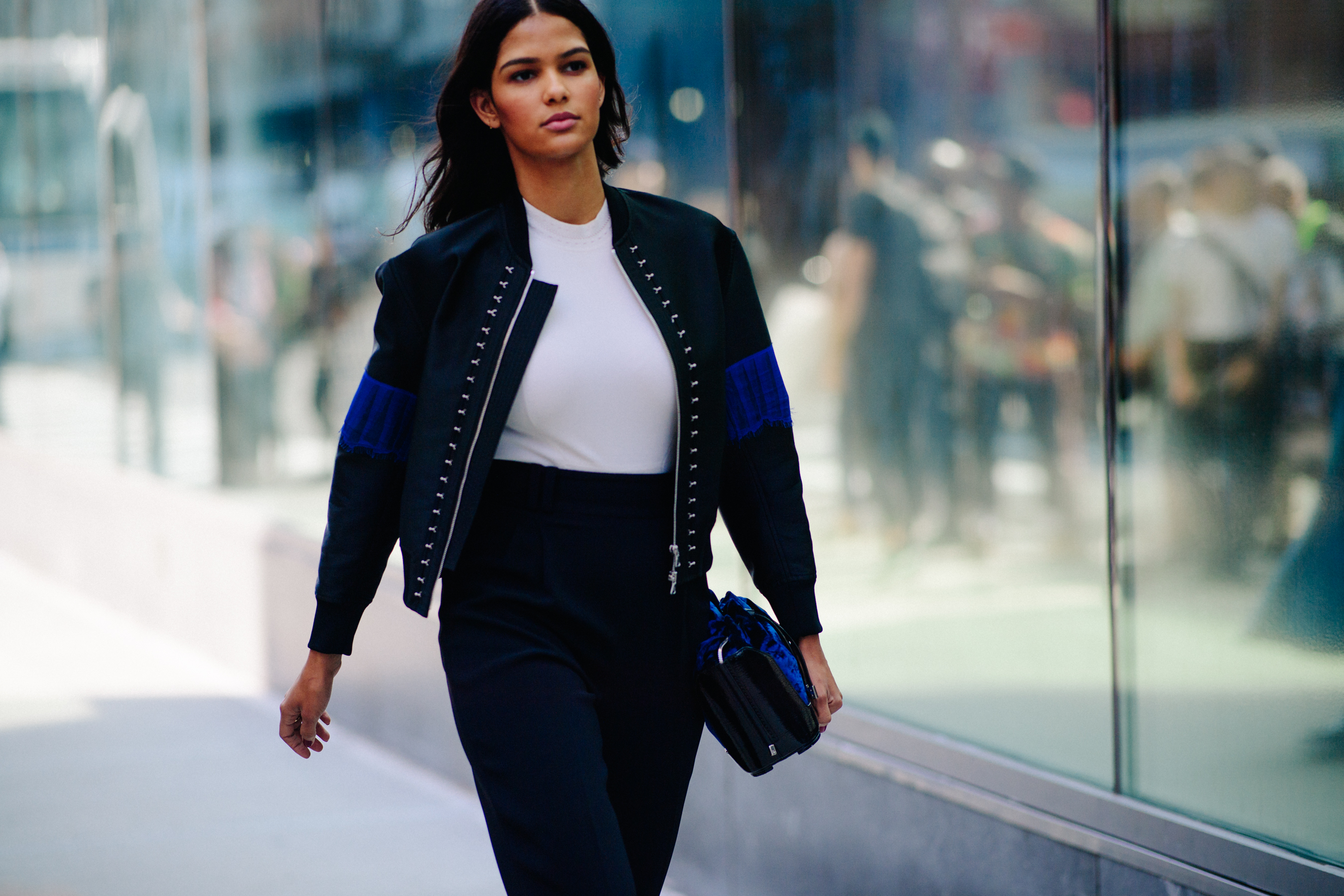 Woman wearing black bomber jacket