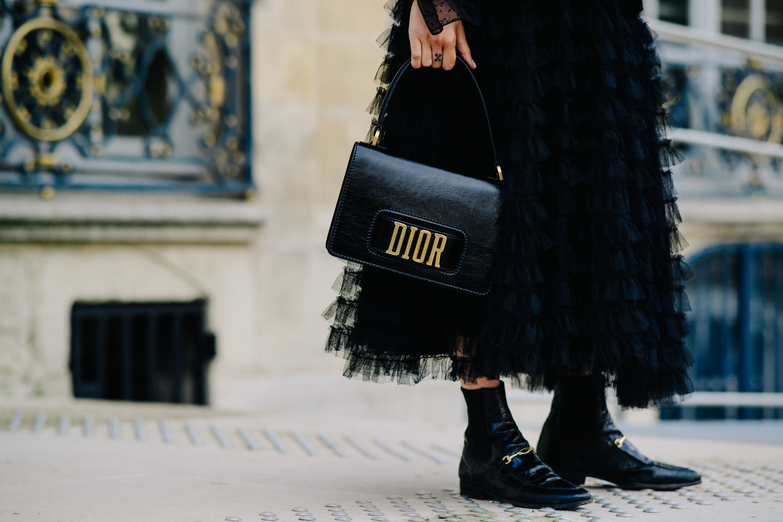 Woman wearing black Dior dress