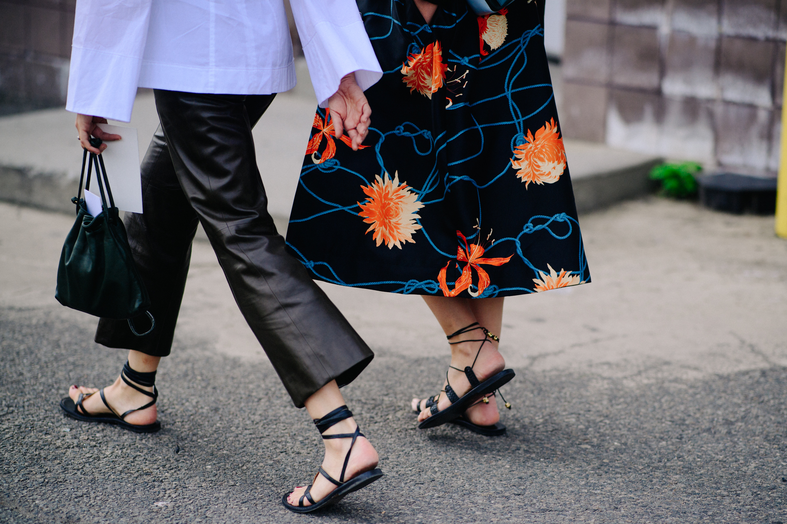 Two women wearing gladiator sandals