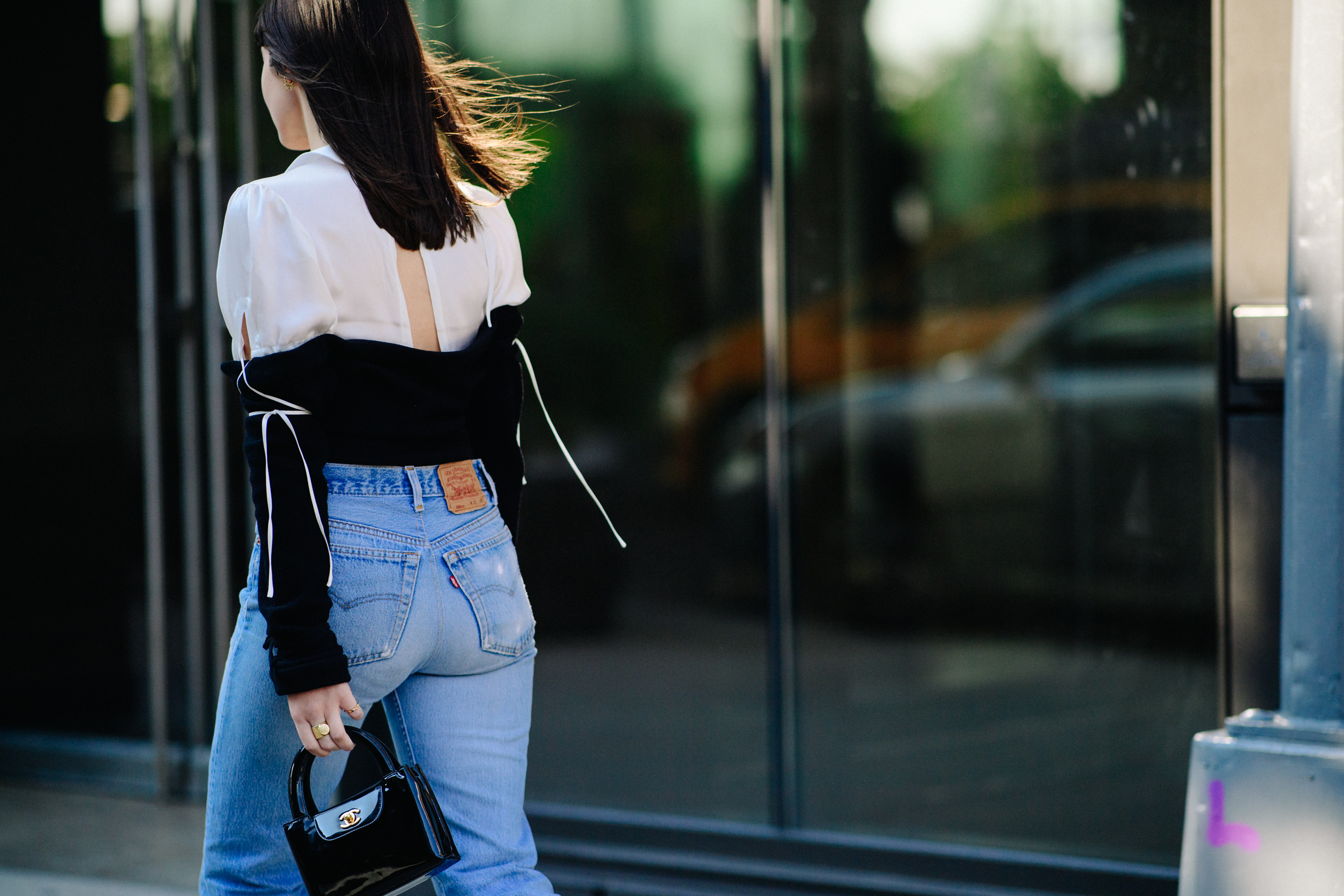 Woman wearing jeans and white top