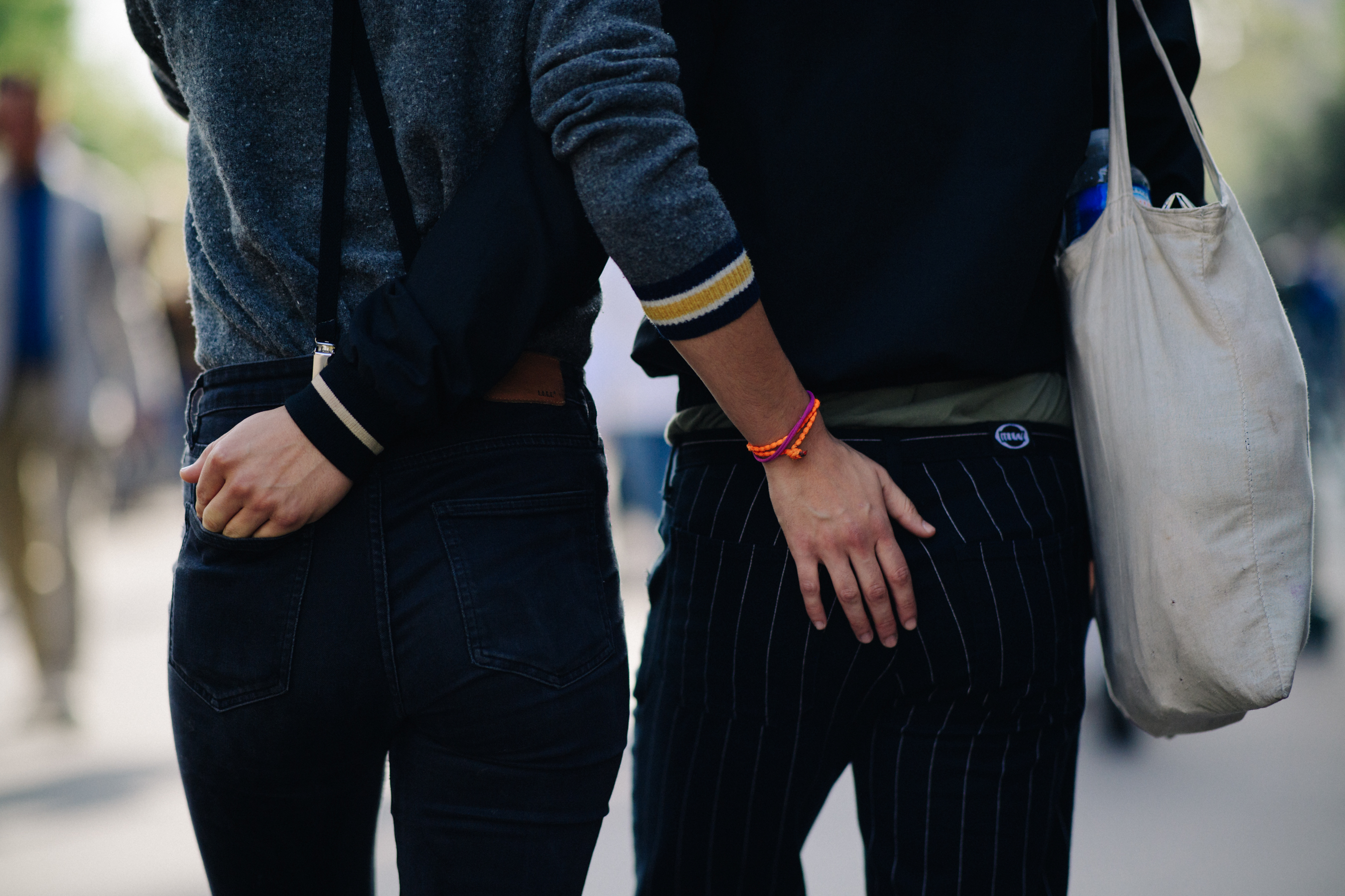 Man and a woman wearing dark pants