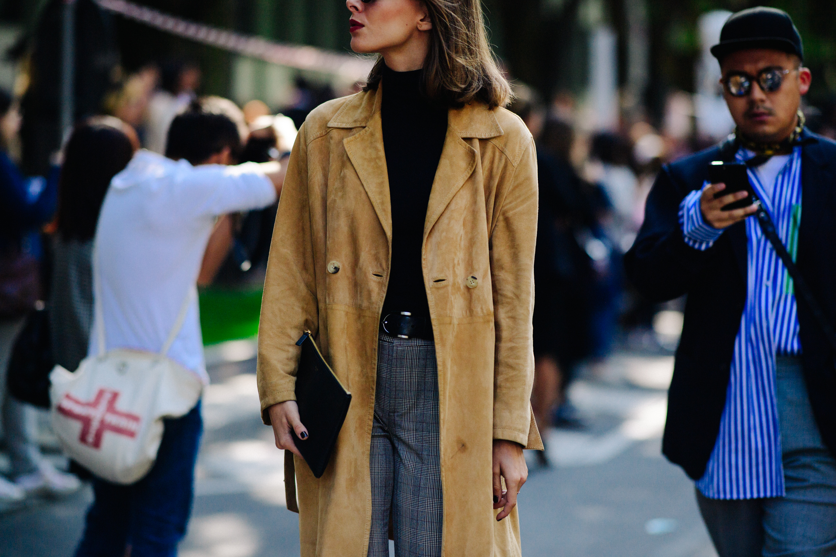 Woman wearing tan long coat