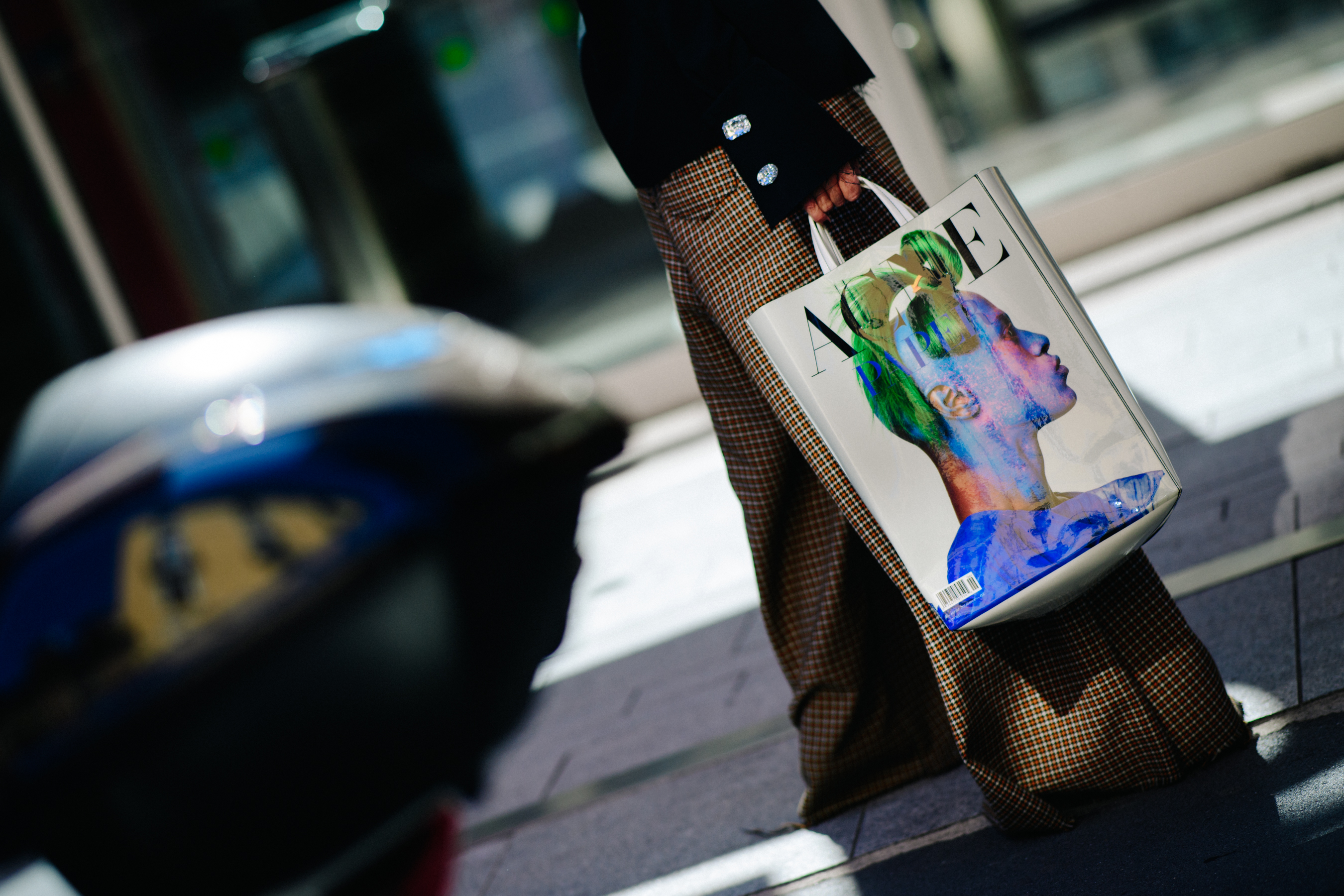 Closeup of woman holding Acne Studios bag