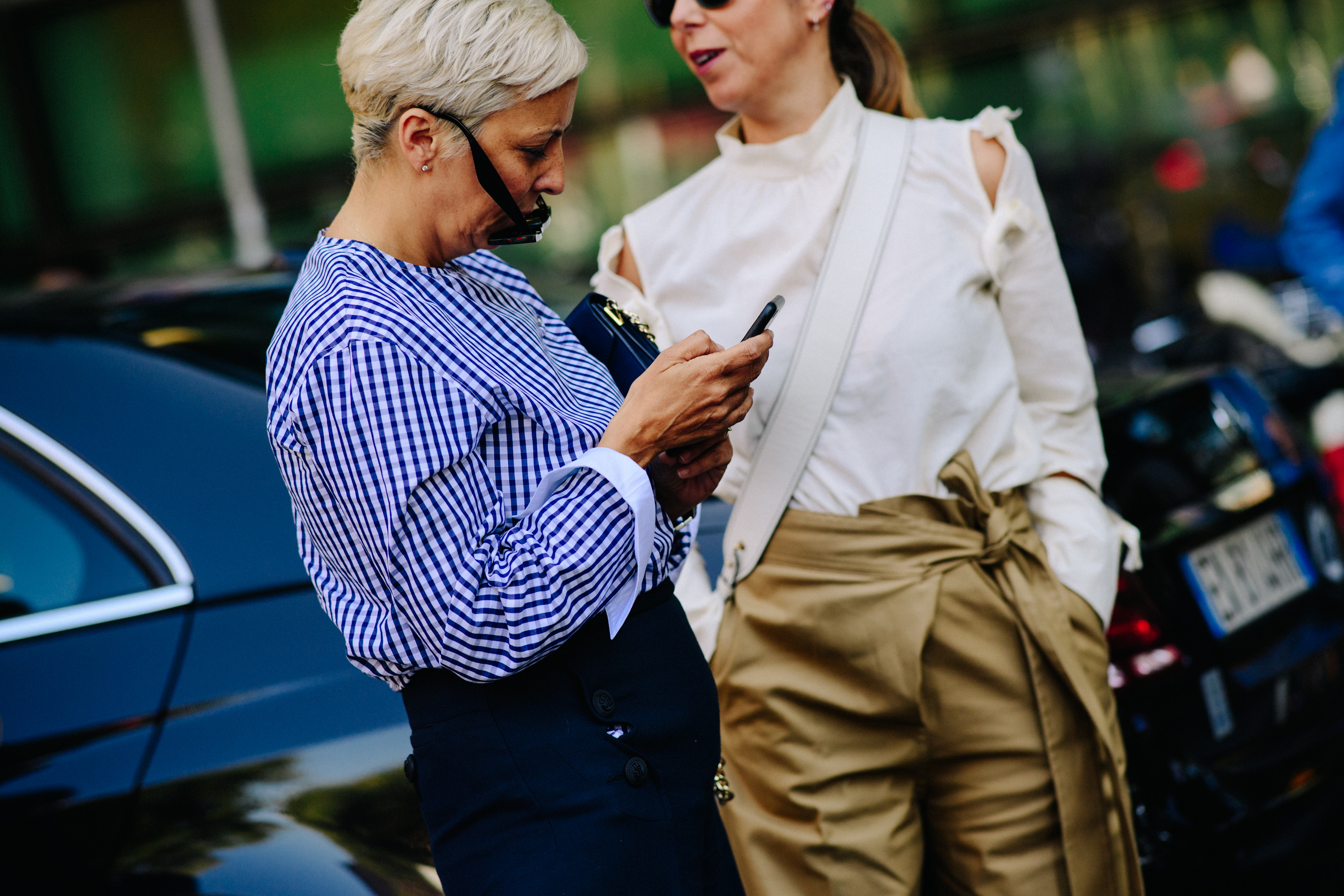 Women wearing shirts and sunglasses