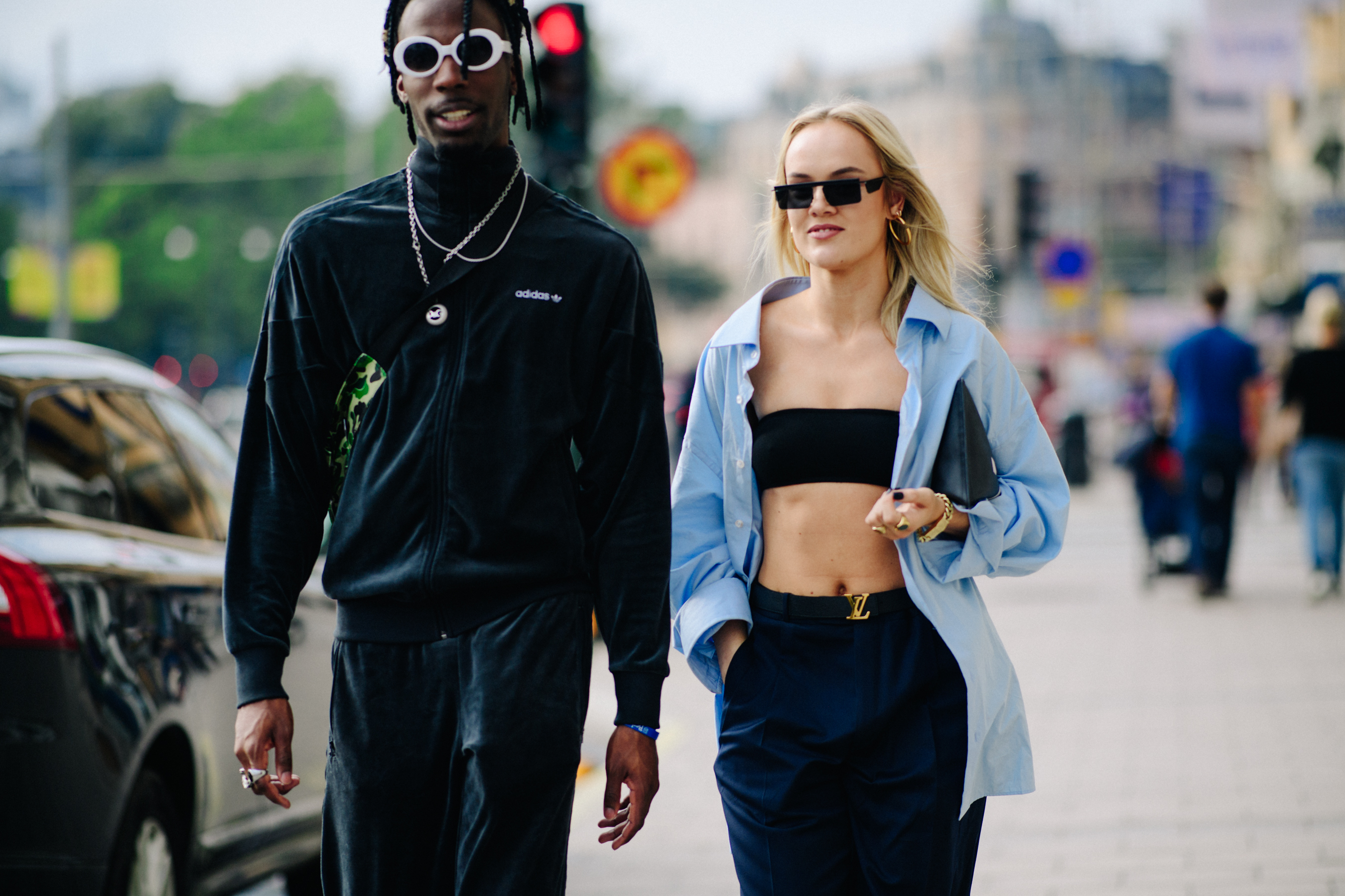 Man and dwoman wearing trackpants before a show