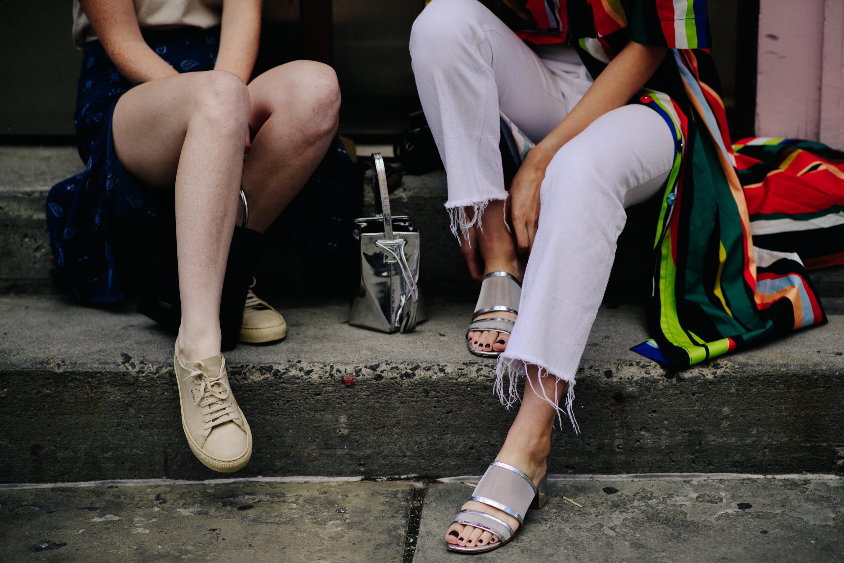 Two women sitting on the stairs