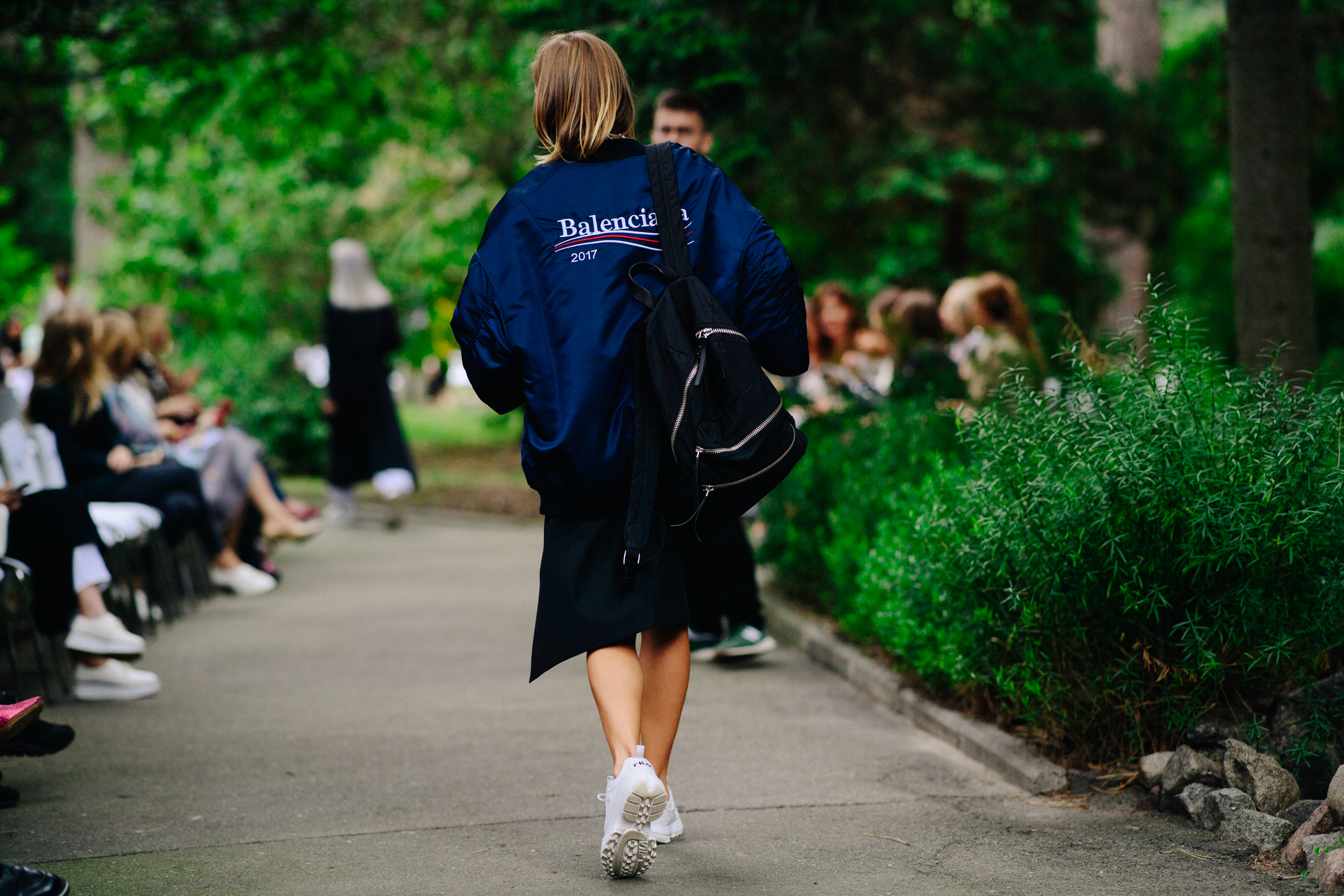 Woman wearing blue Balenciaga bomber