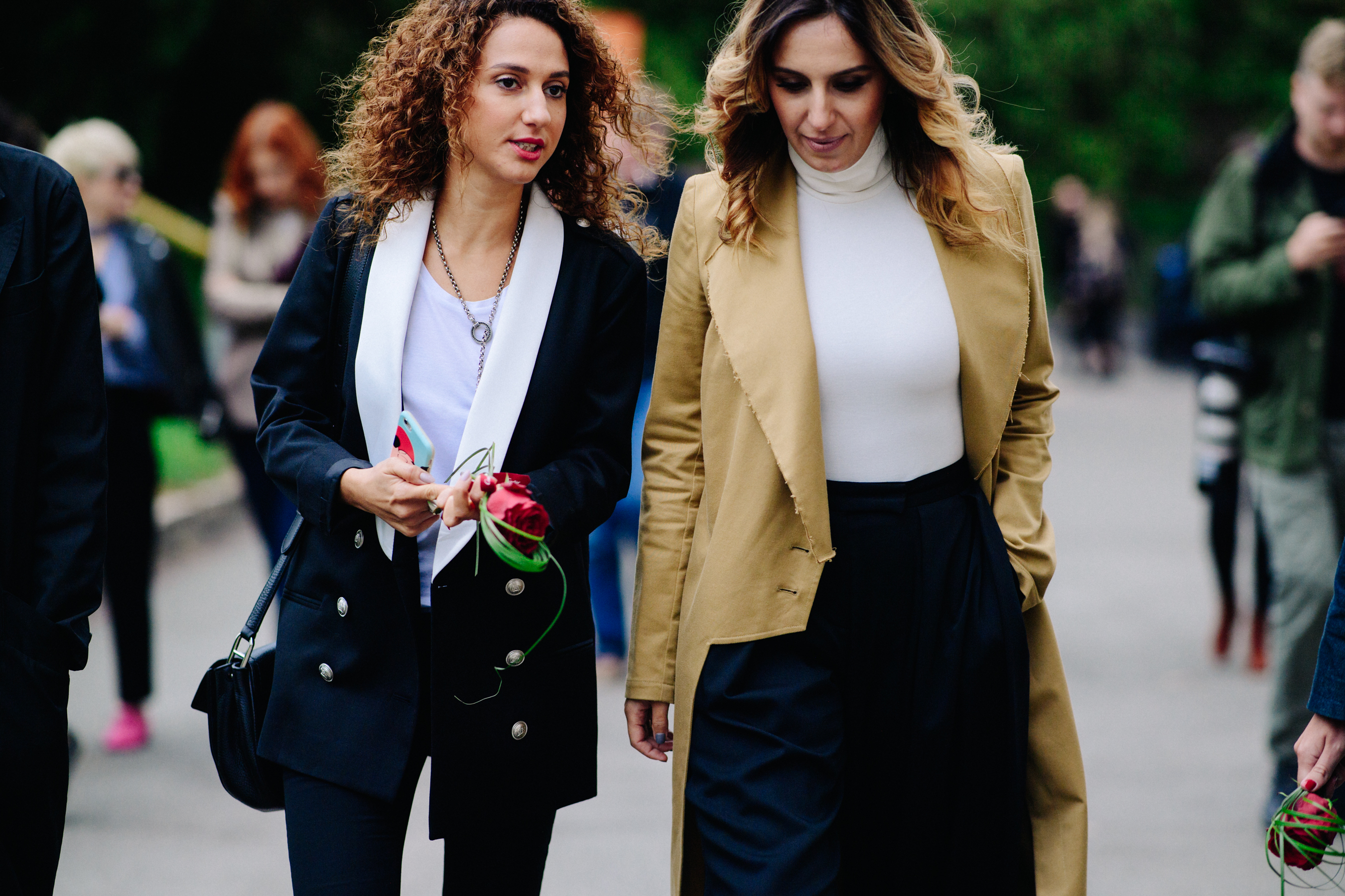 Two women wearing blazers