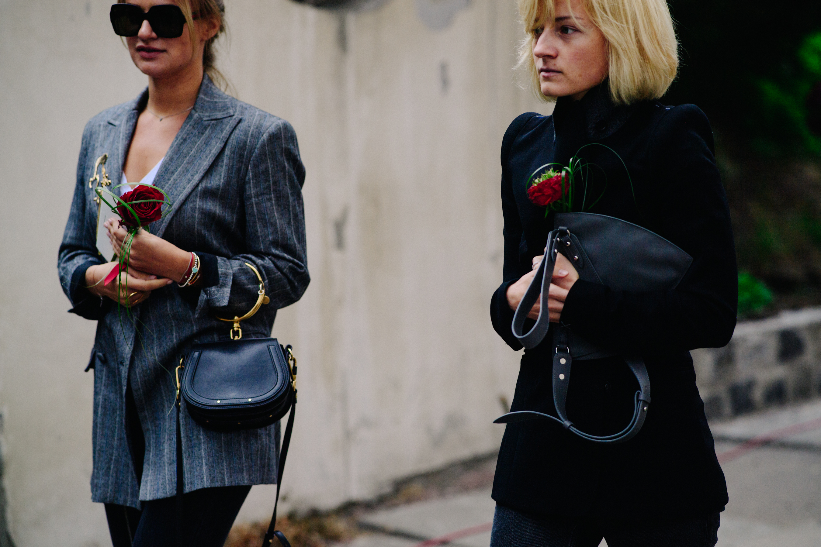 Two women wearing blazers