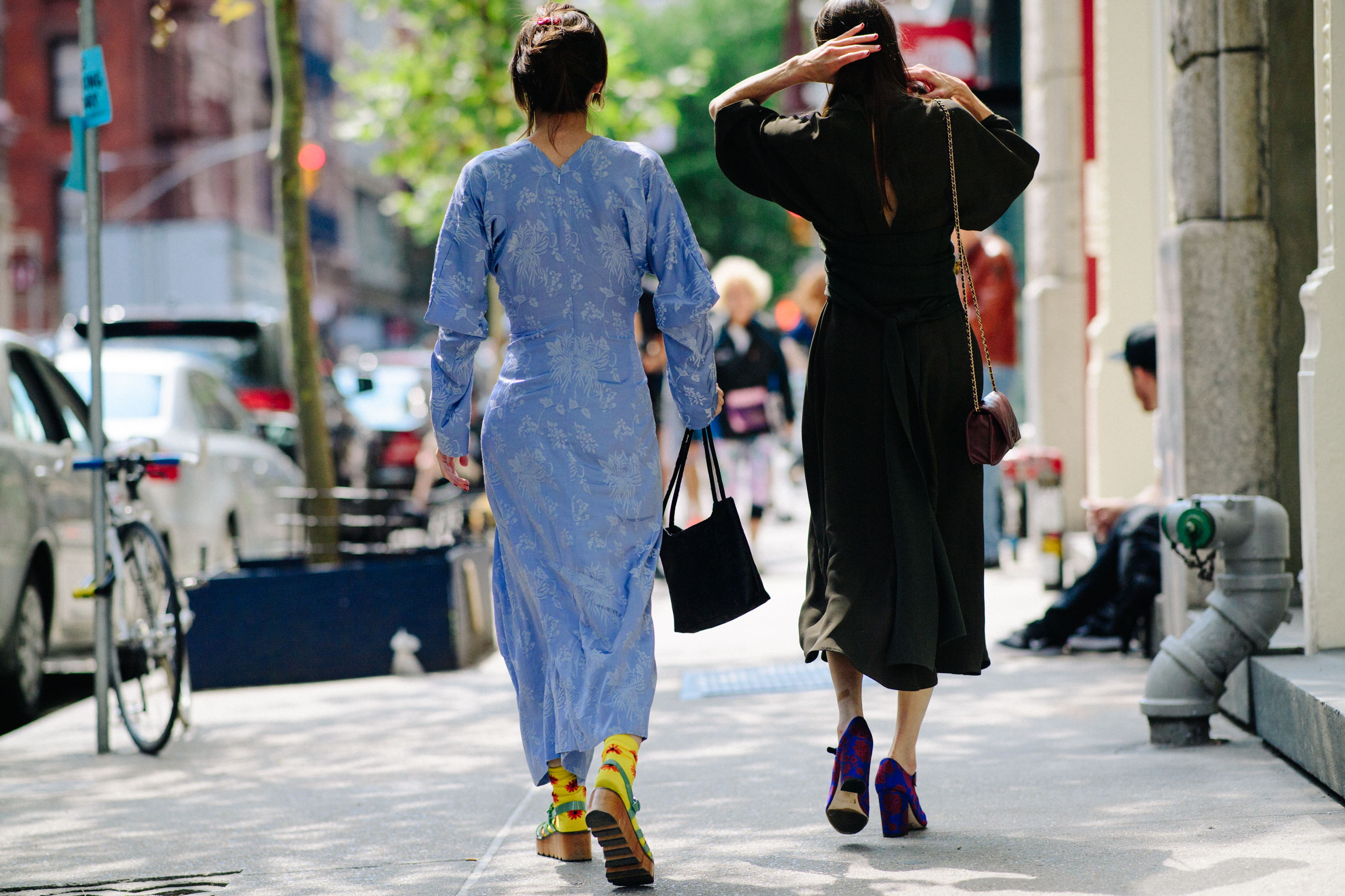 Two women attending fashion show