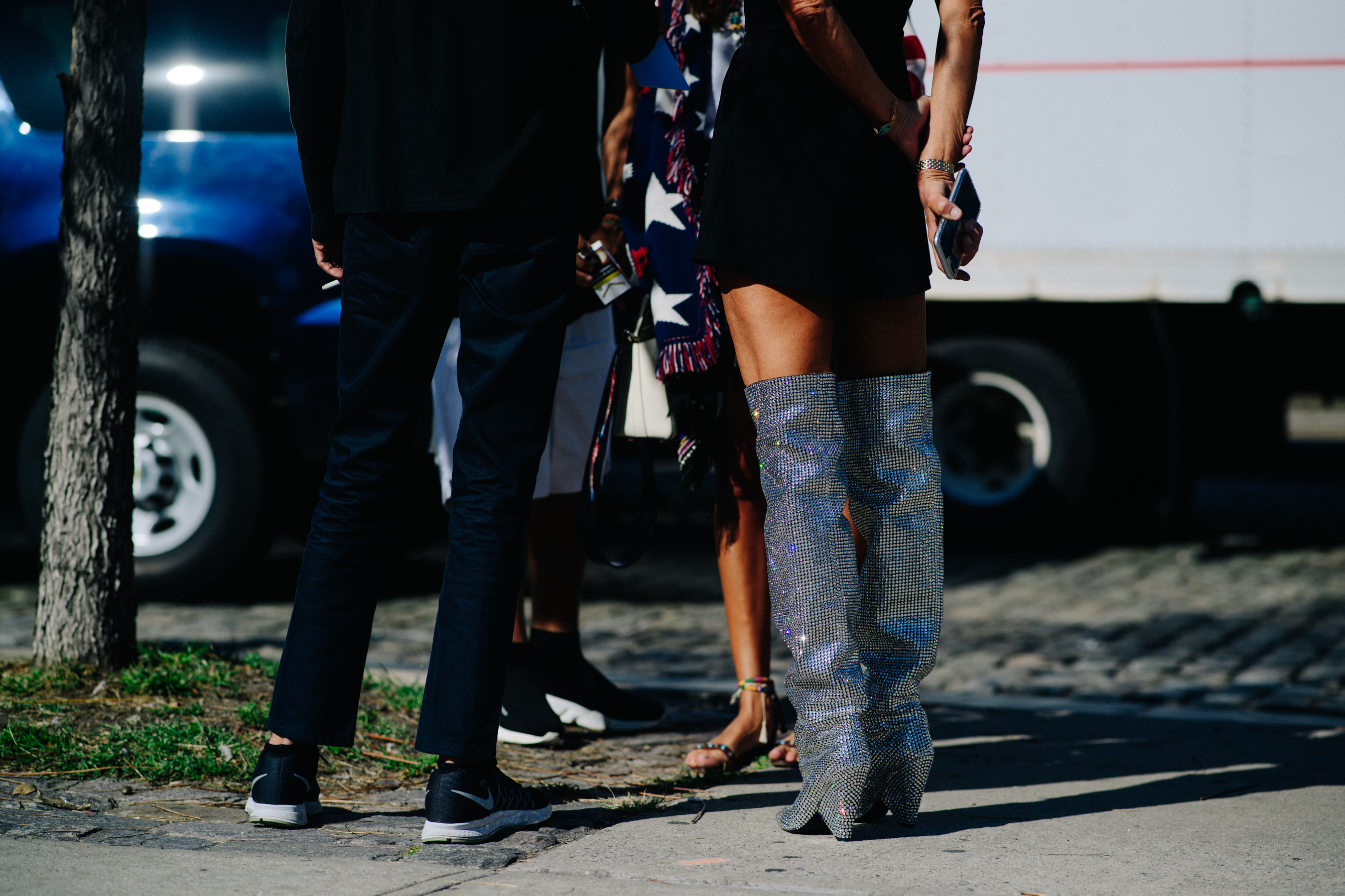 Italian stylist wearing Saint Laurent shiny boots