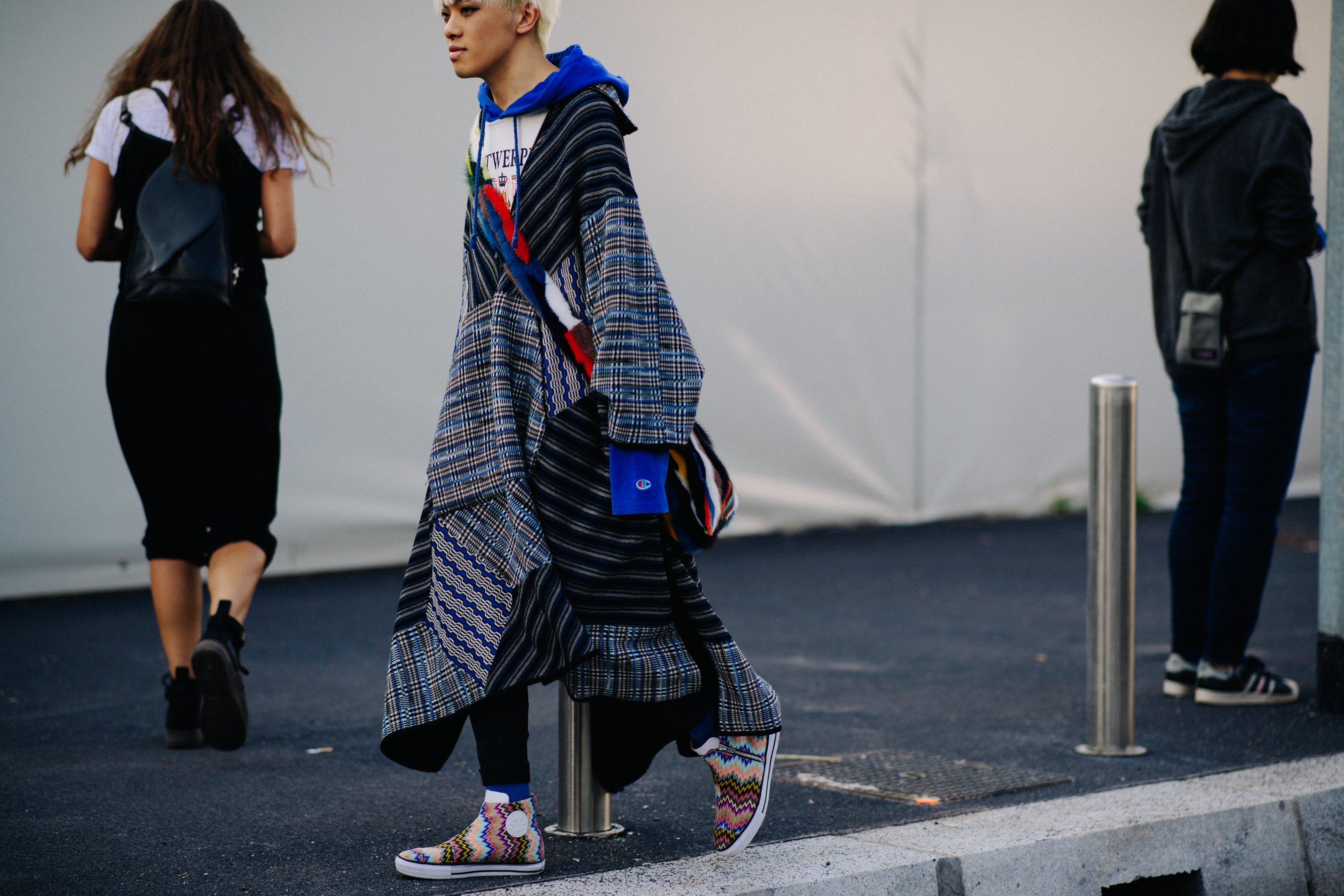 Woman wearing oversized hoodie and coat