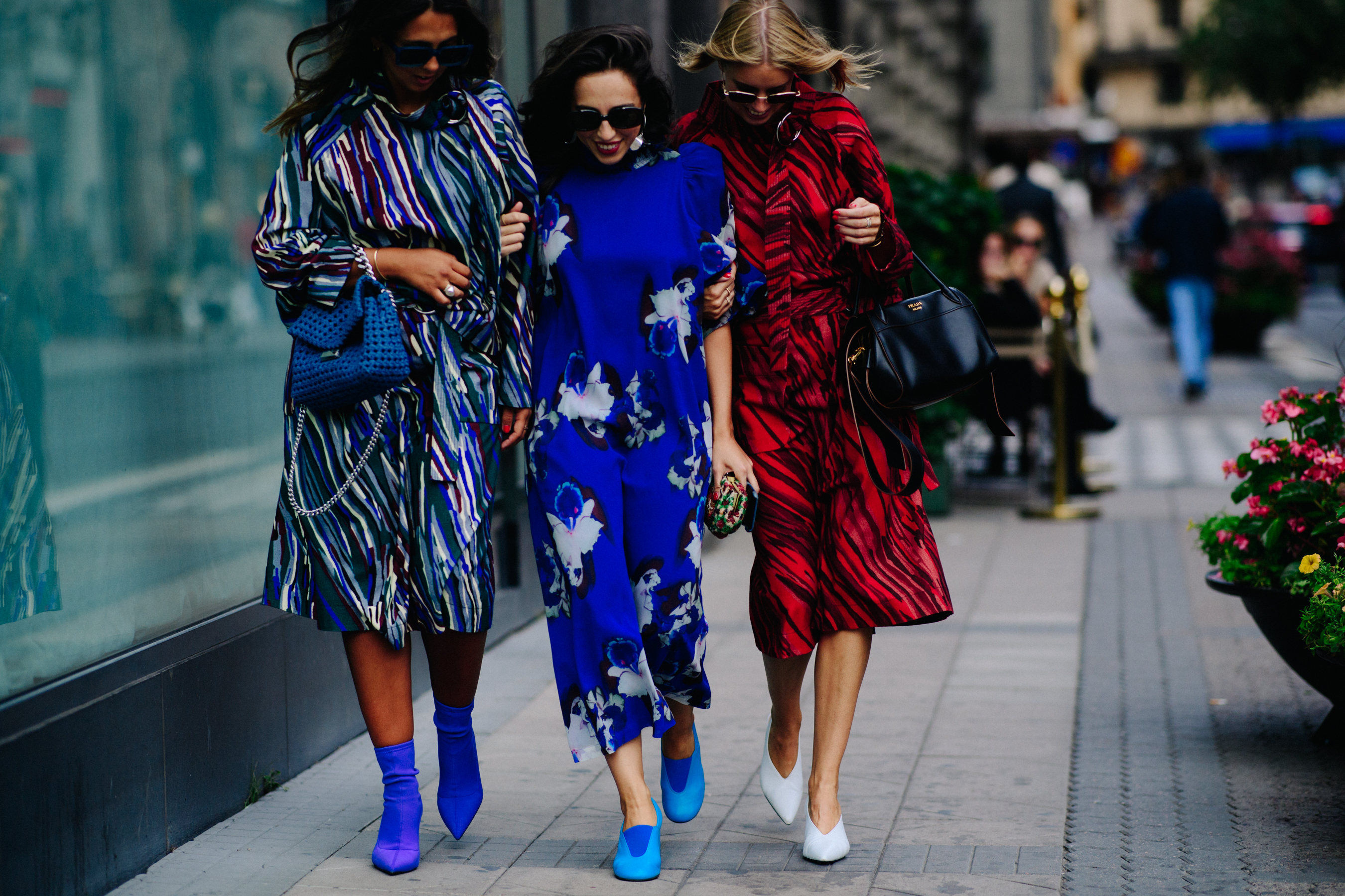 Group of women wearing colourful dresses