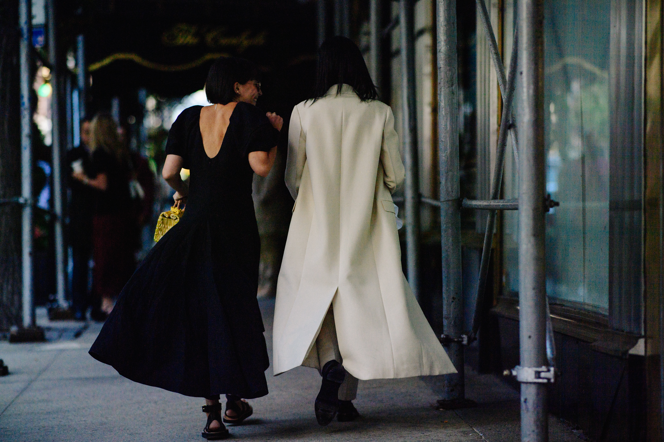 Two women wearing black and white