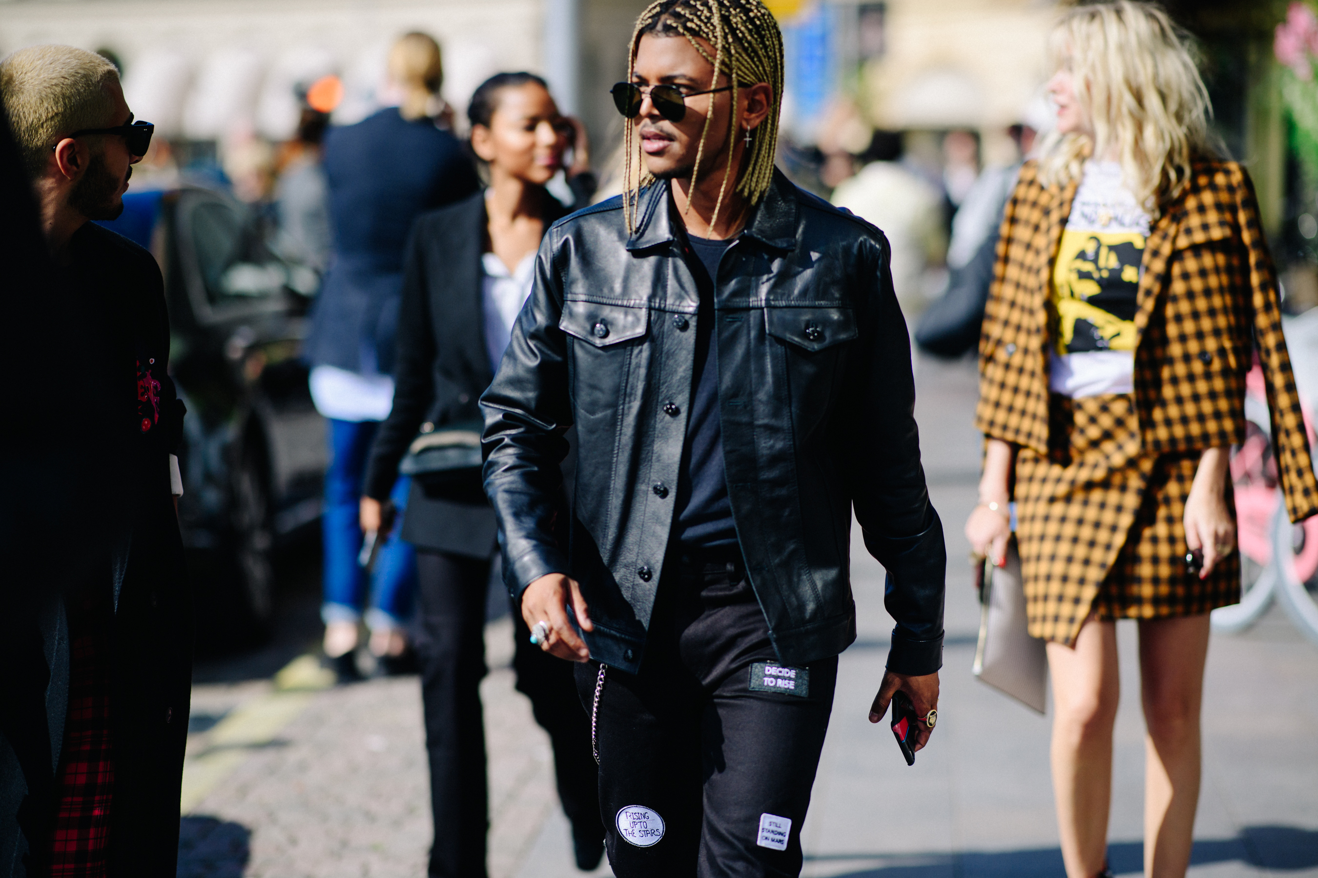 Man with braids wearing all black