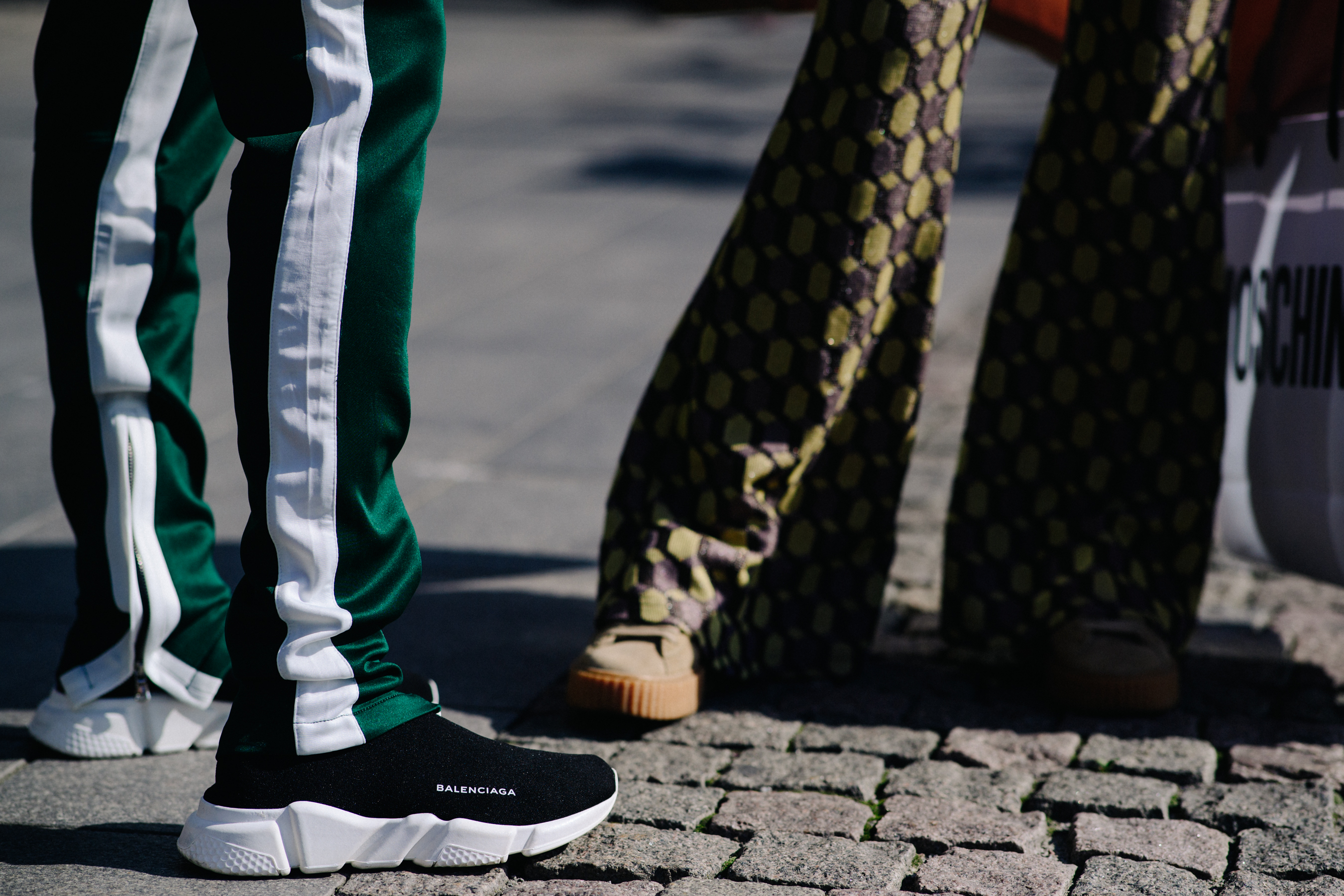 Man wearing sweat pants and Balenciaga runner