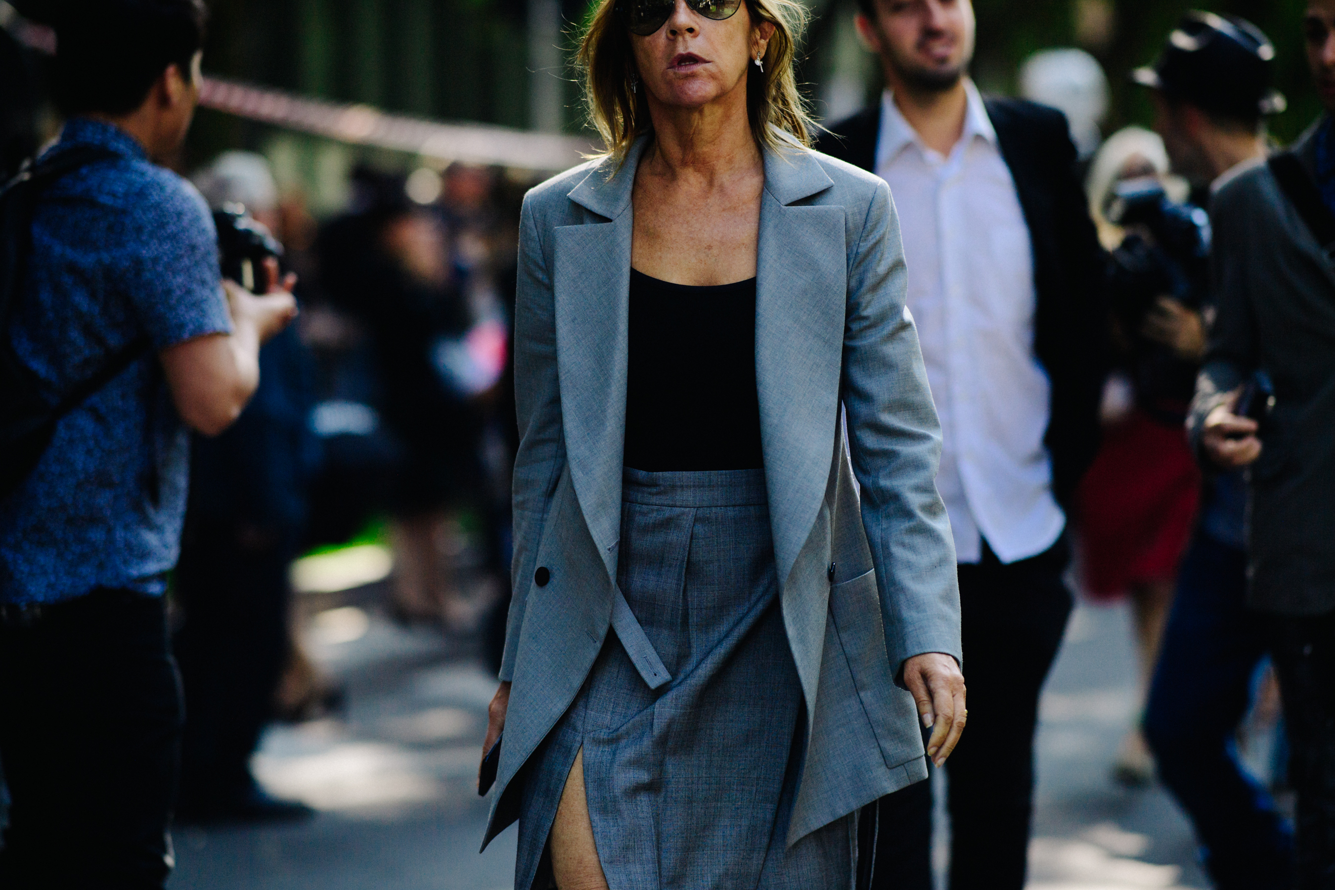Editor wearing grey suit outfit