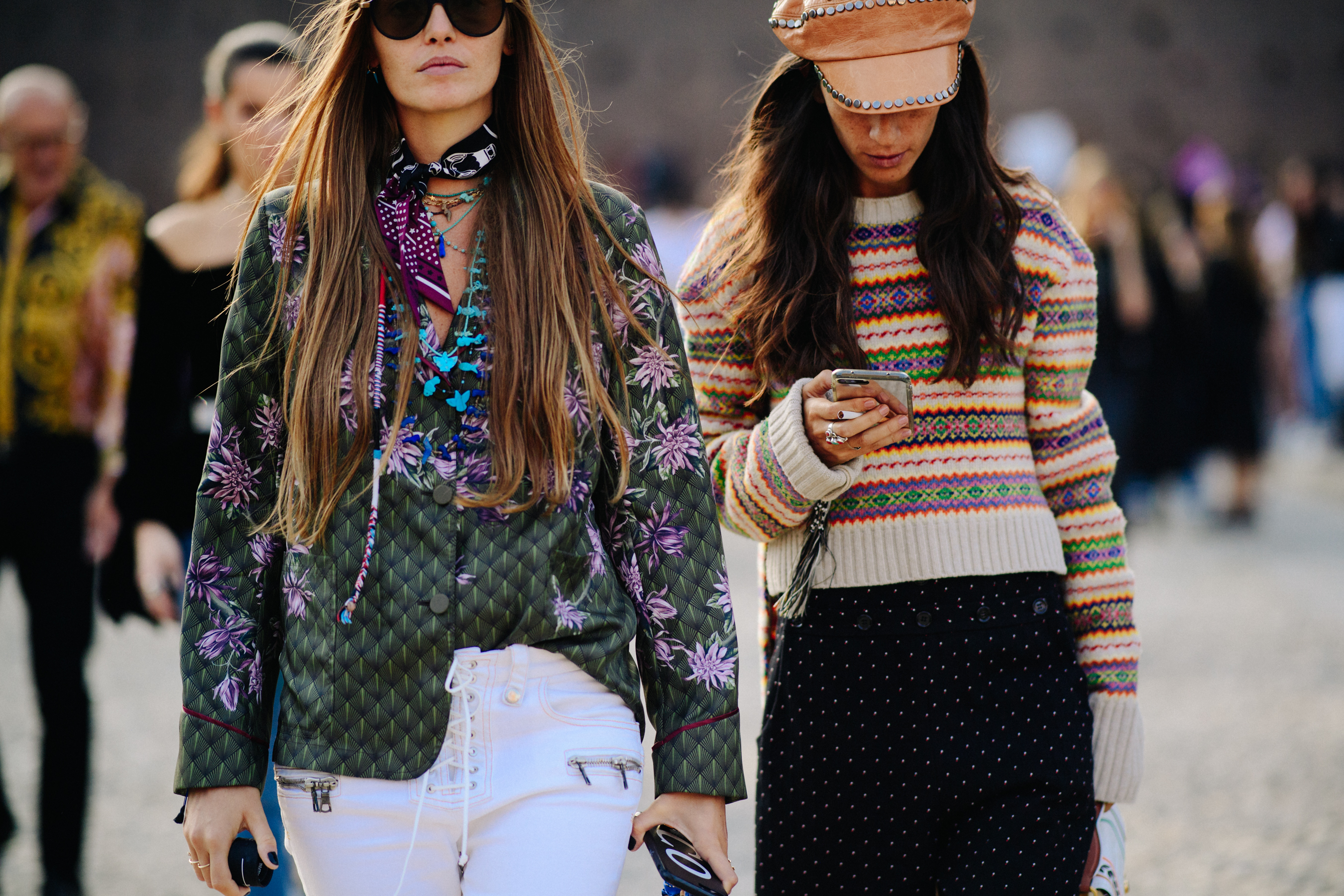 Two women wearing patterned tops