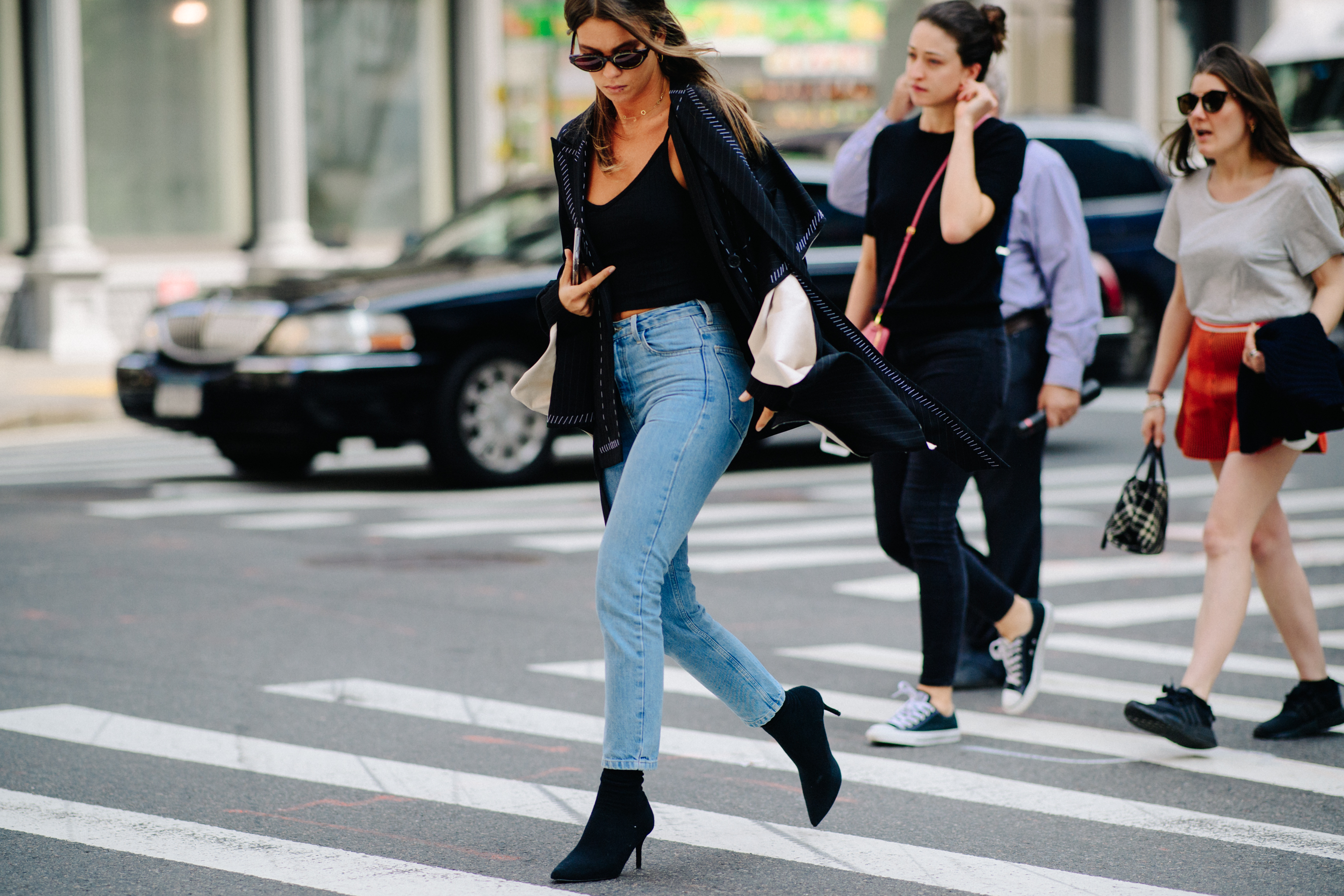 Woman wearing black top and jeans