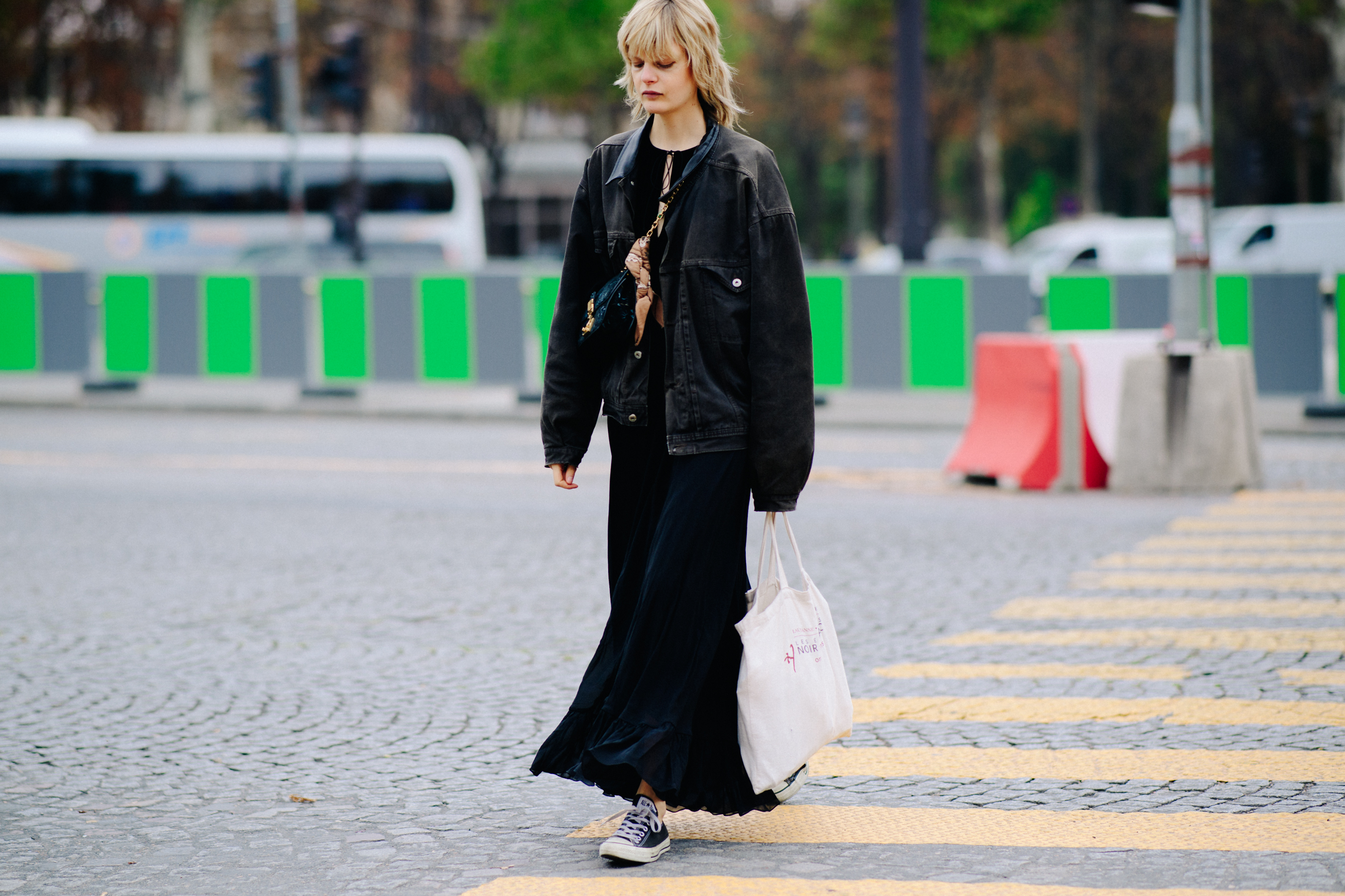 Model wearing long skirt after a show