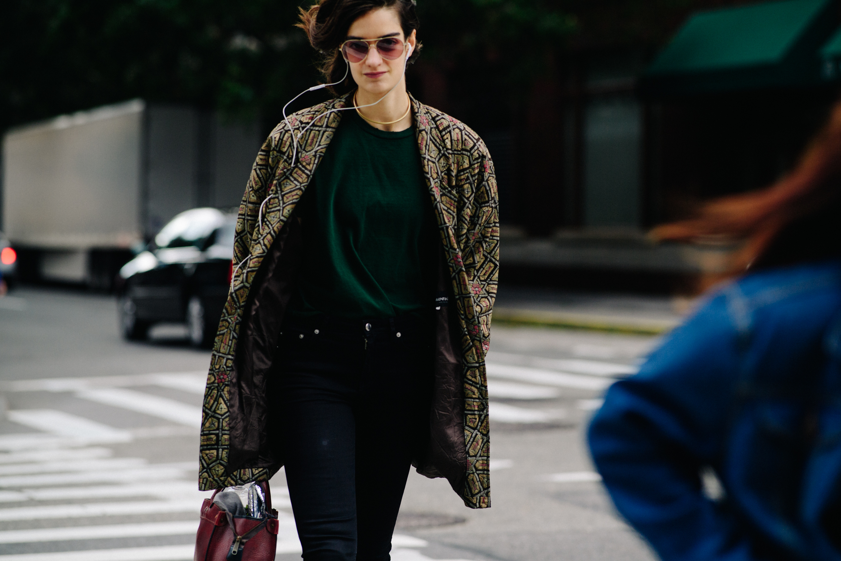 French model wearing coat and glasses