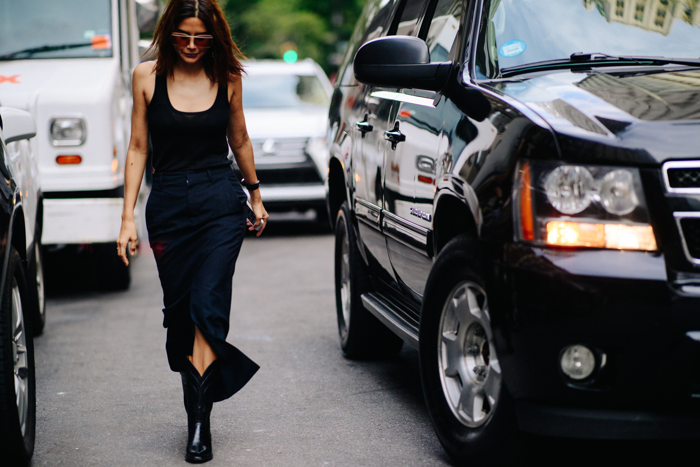 Australian editor wearing black dress and cowboy boots