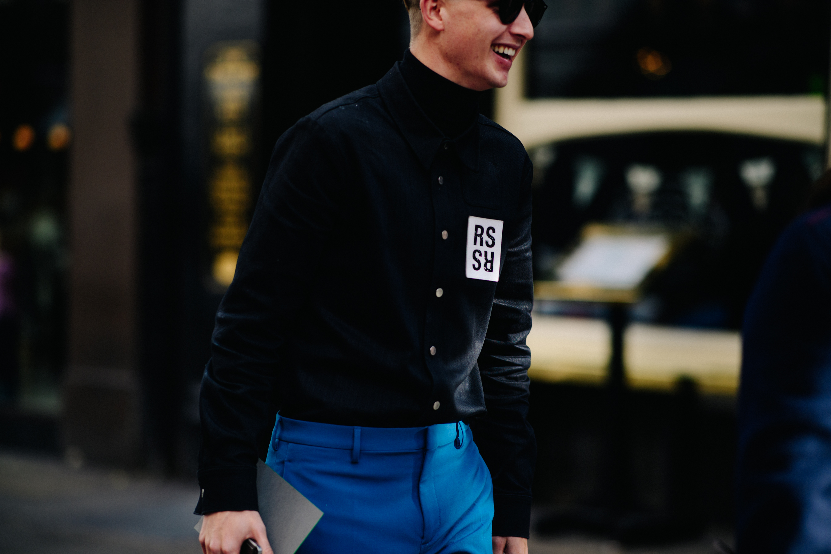 Man wearing black Raf Simons Simons shirt
