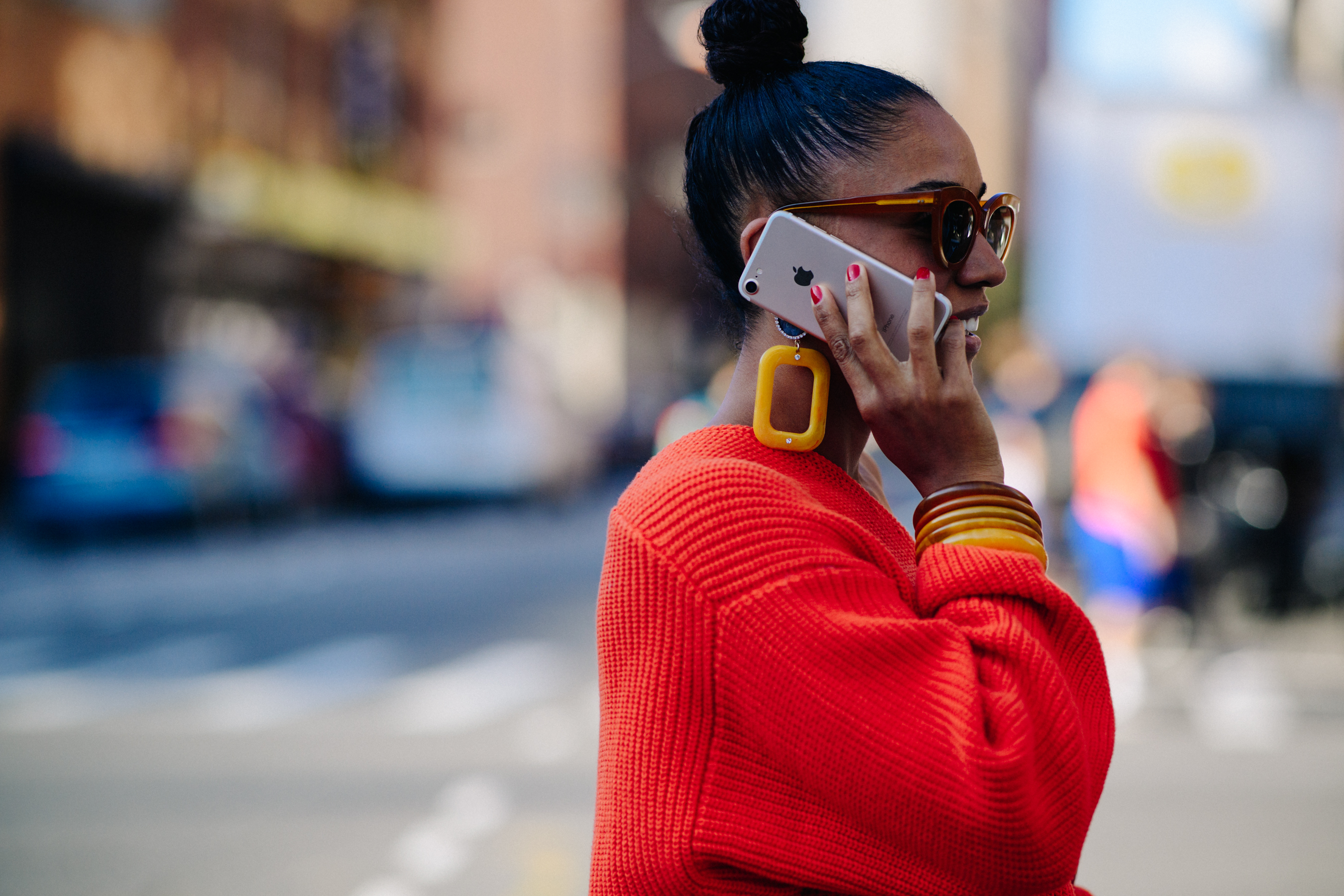 Woman wearing sweater and big jewellery