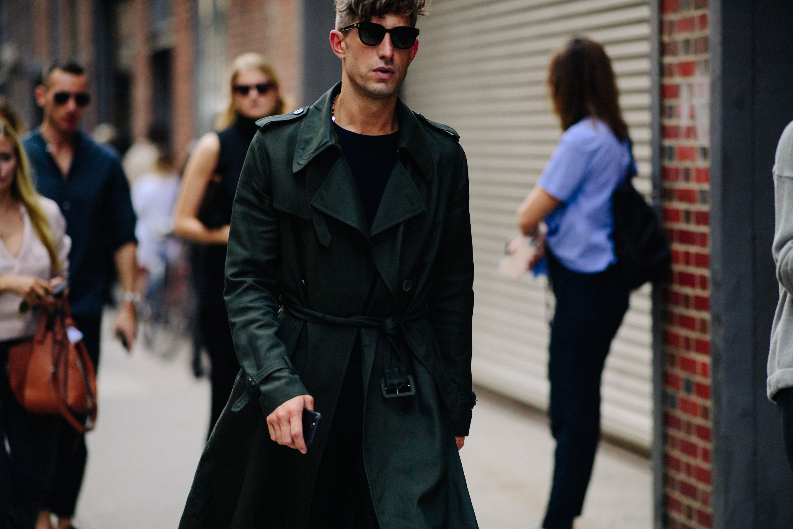 Man wearing green trench coat
