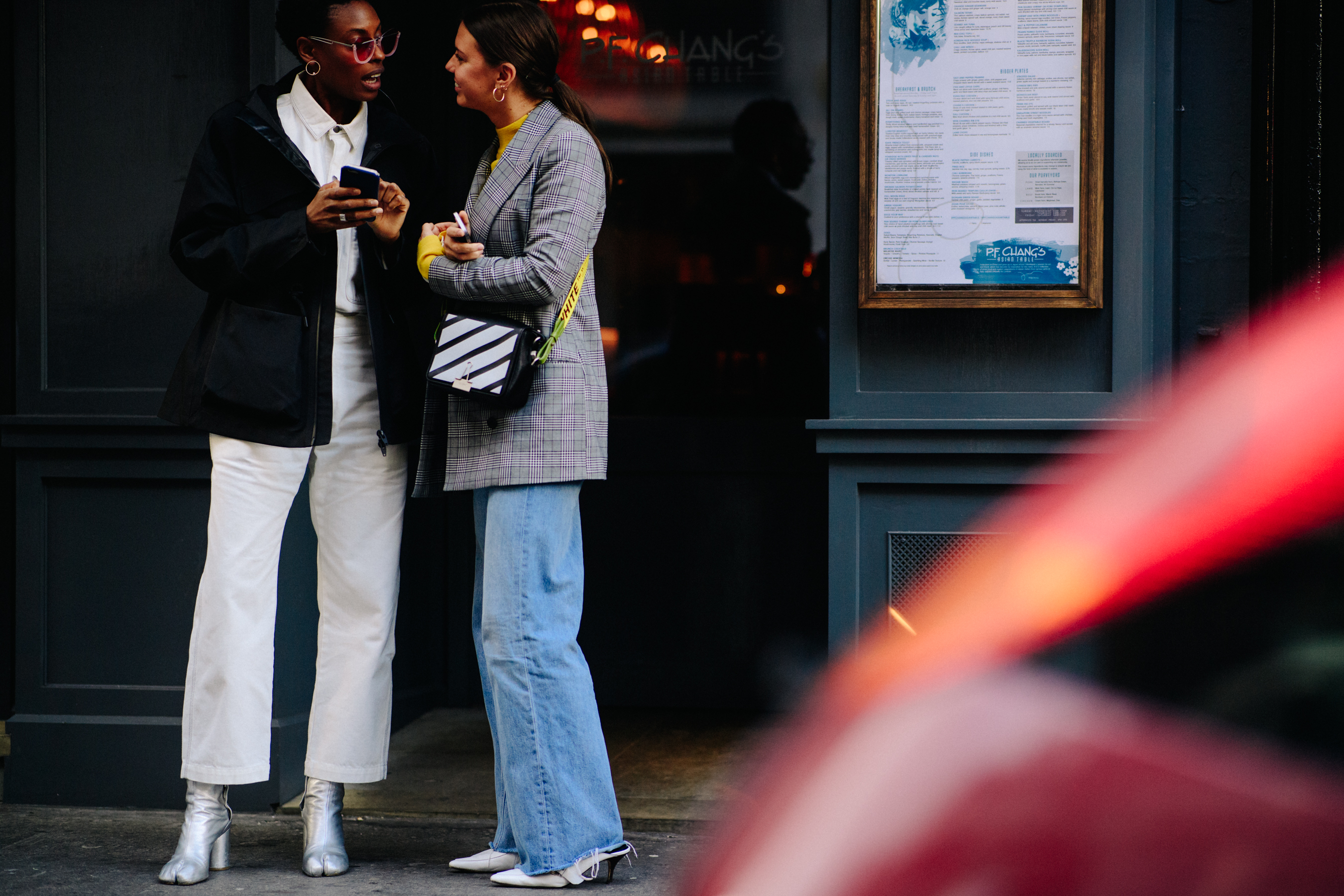 Two women wearing Off-White after a show