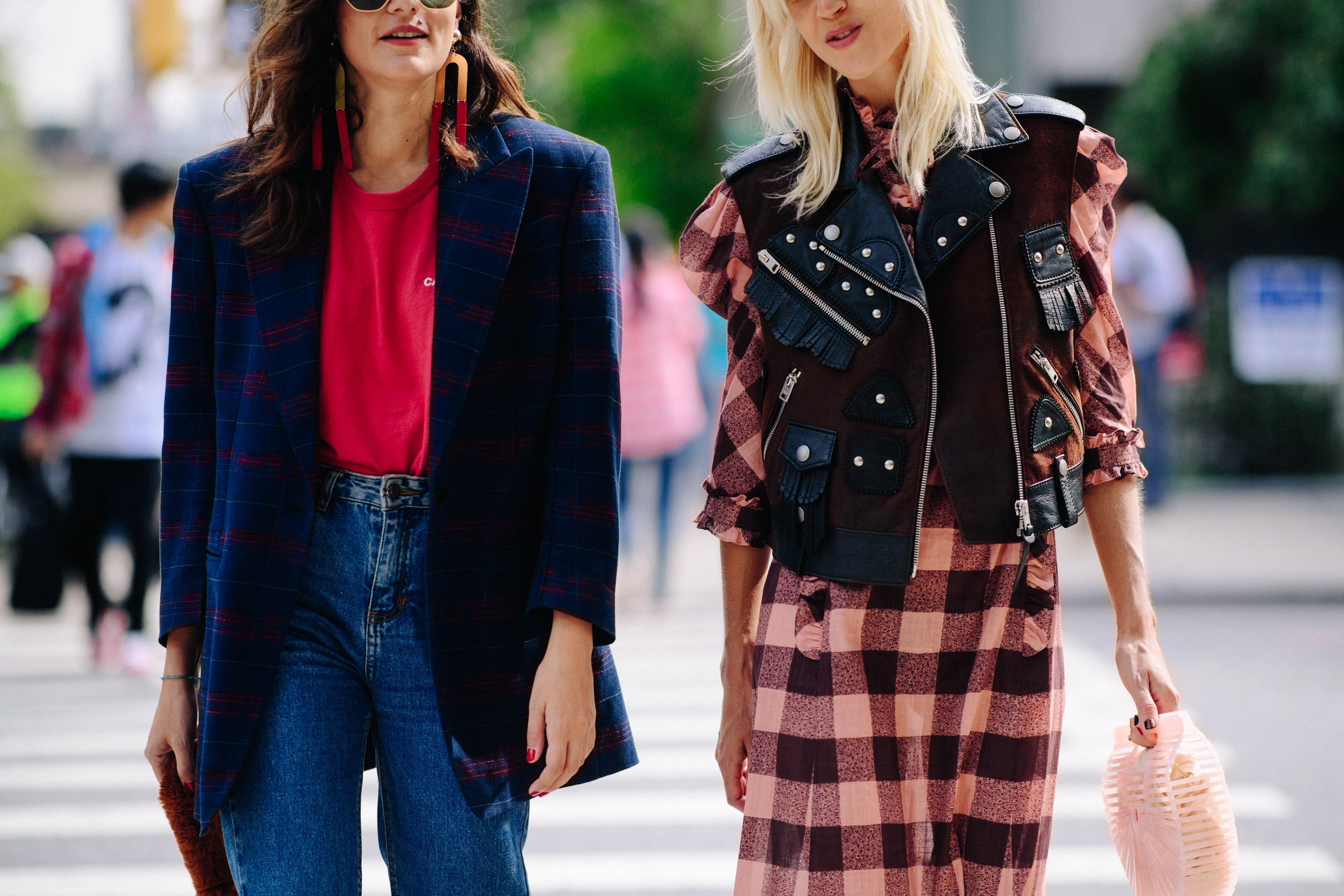 Two women wearing blazer and vest