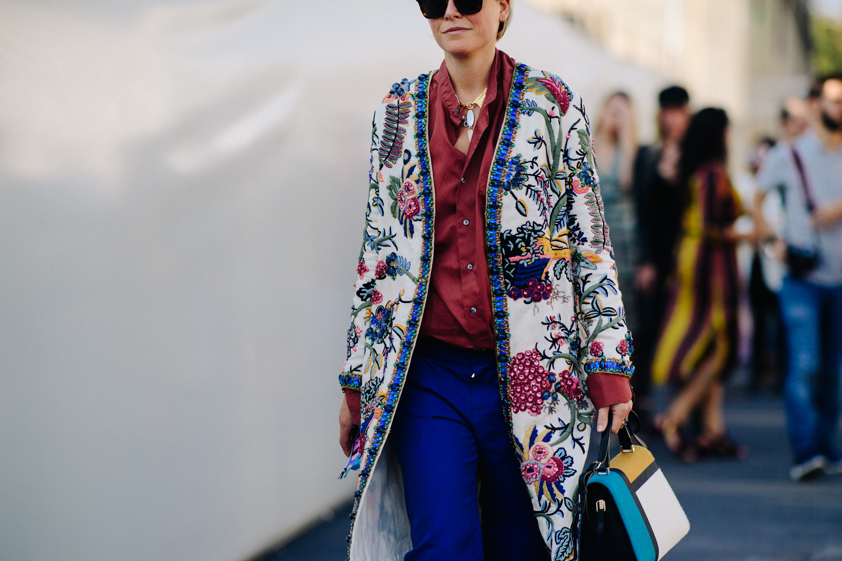 Woman wearing multi colour sequin coat