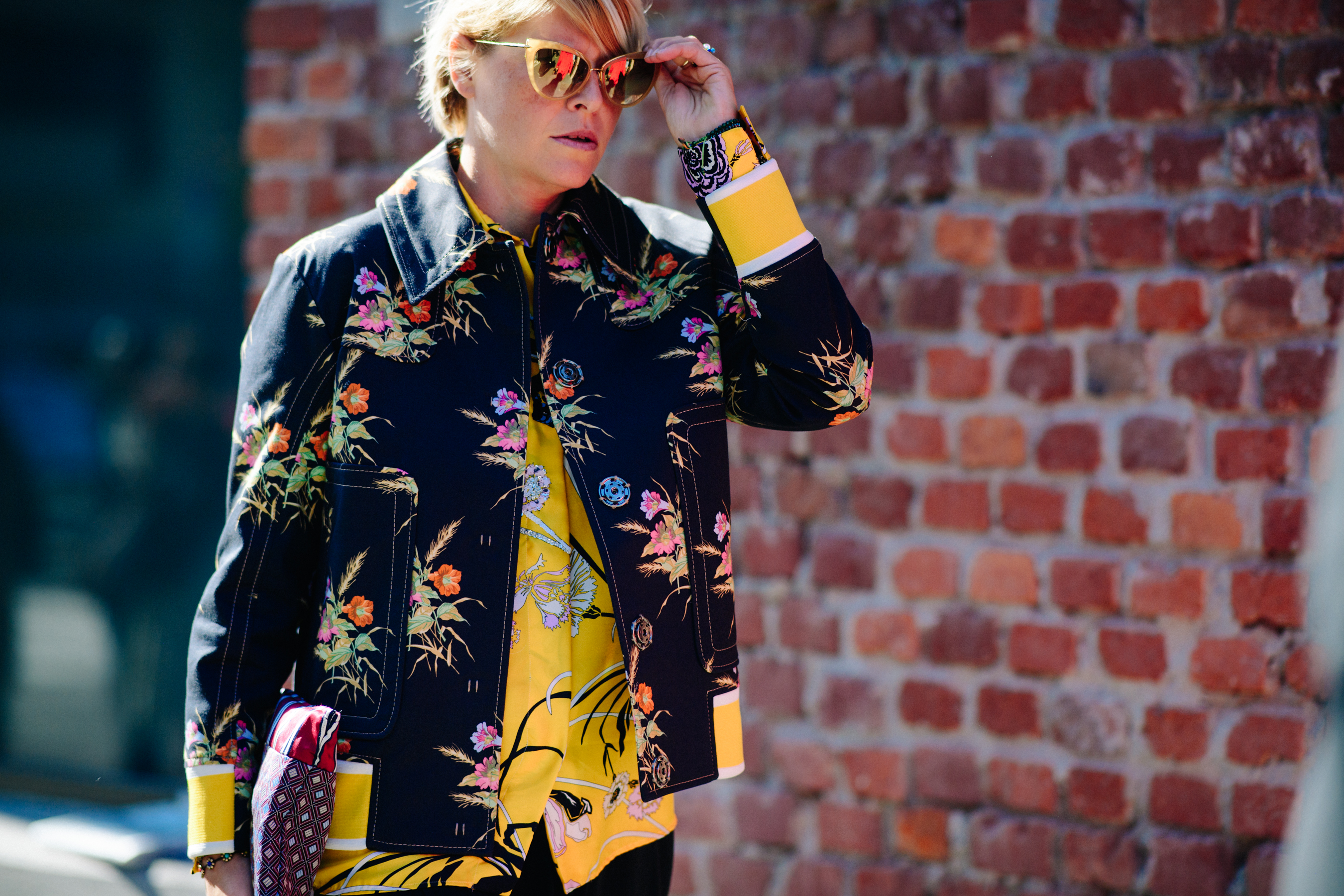 Woman wearing floral denim jacket