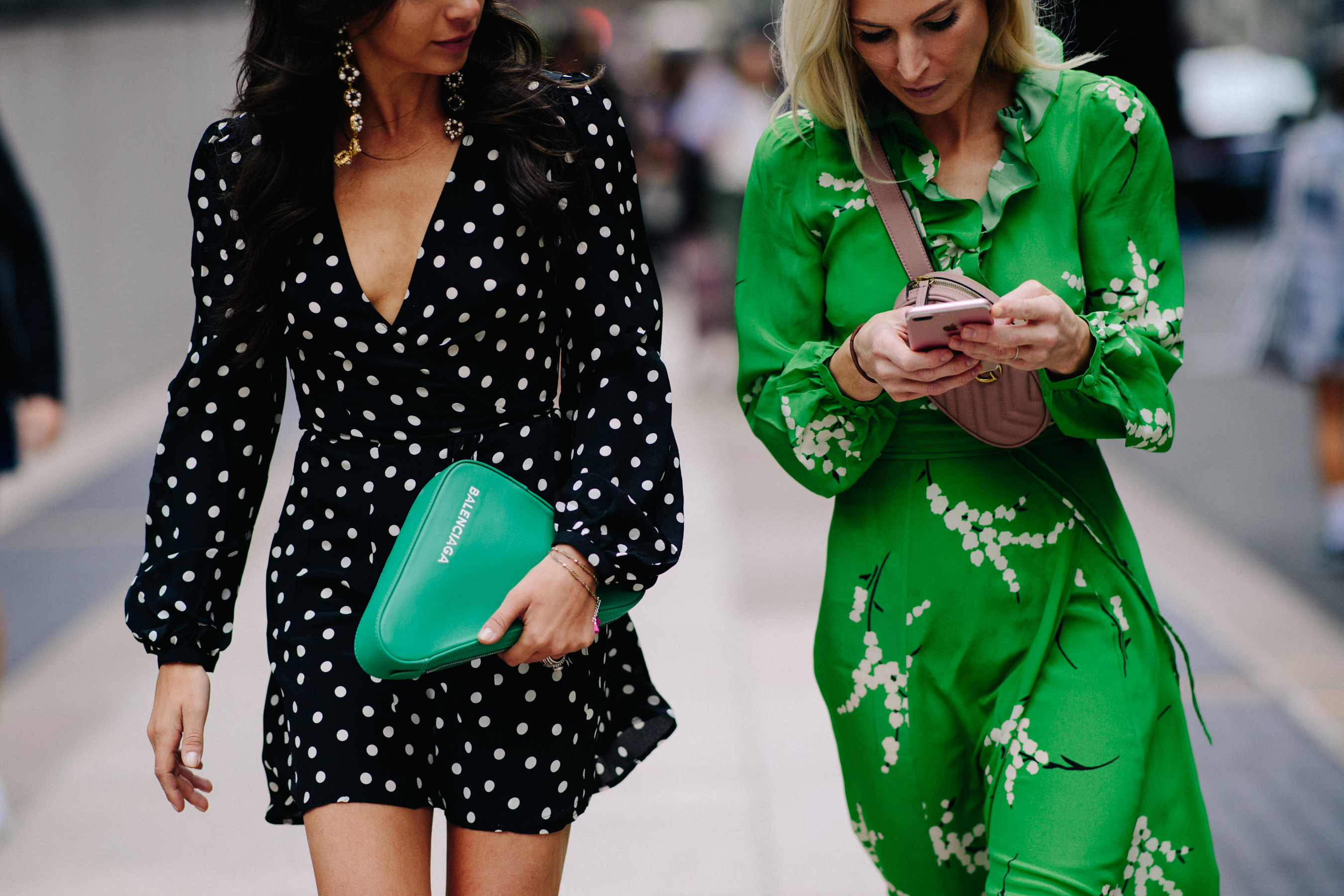 Two women wearing summer dresses