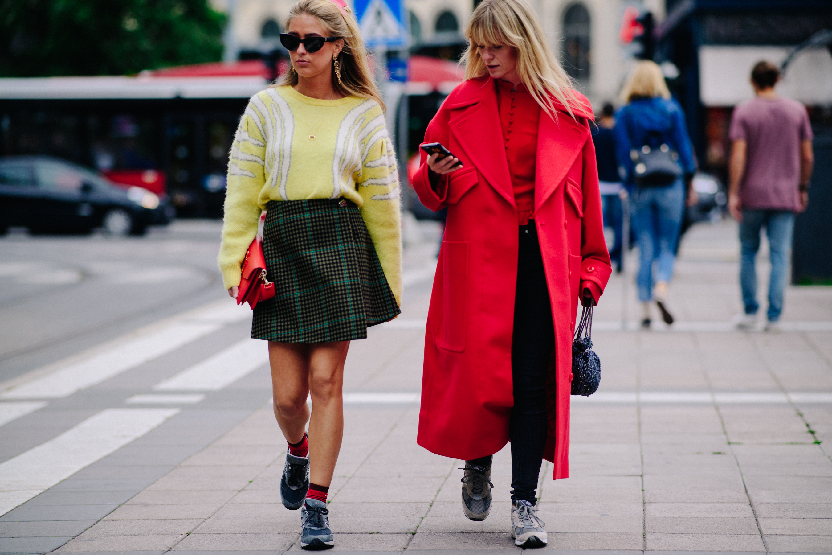 Two women wearing yellow and red
