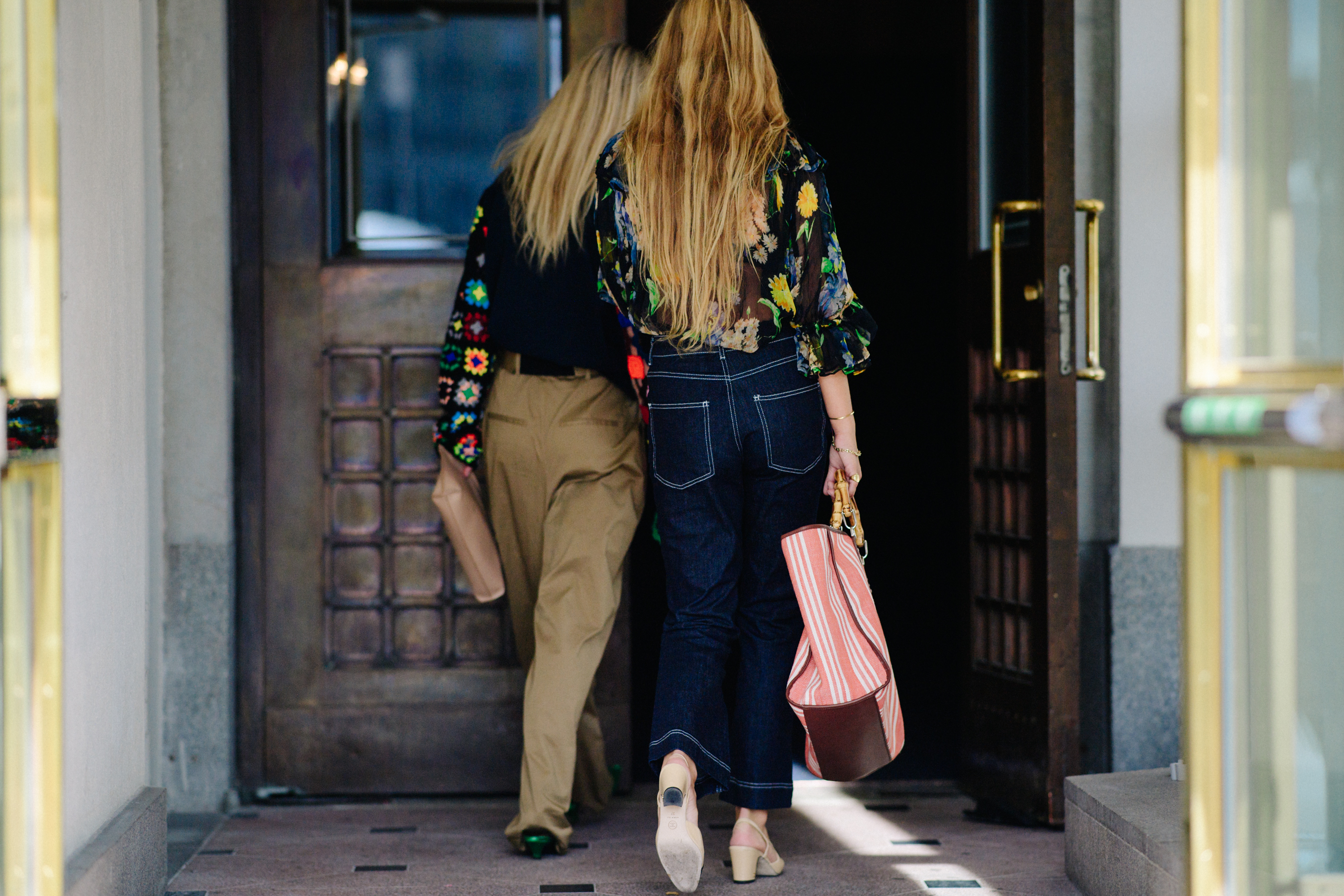 Two women with long blonde hair