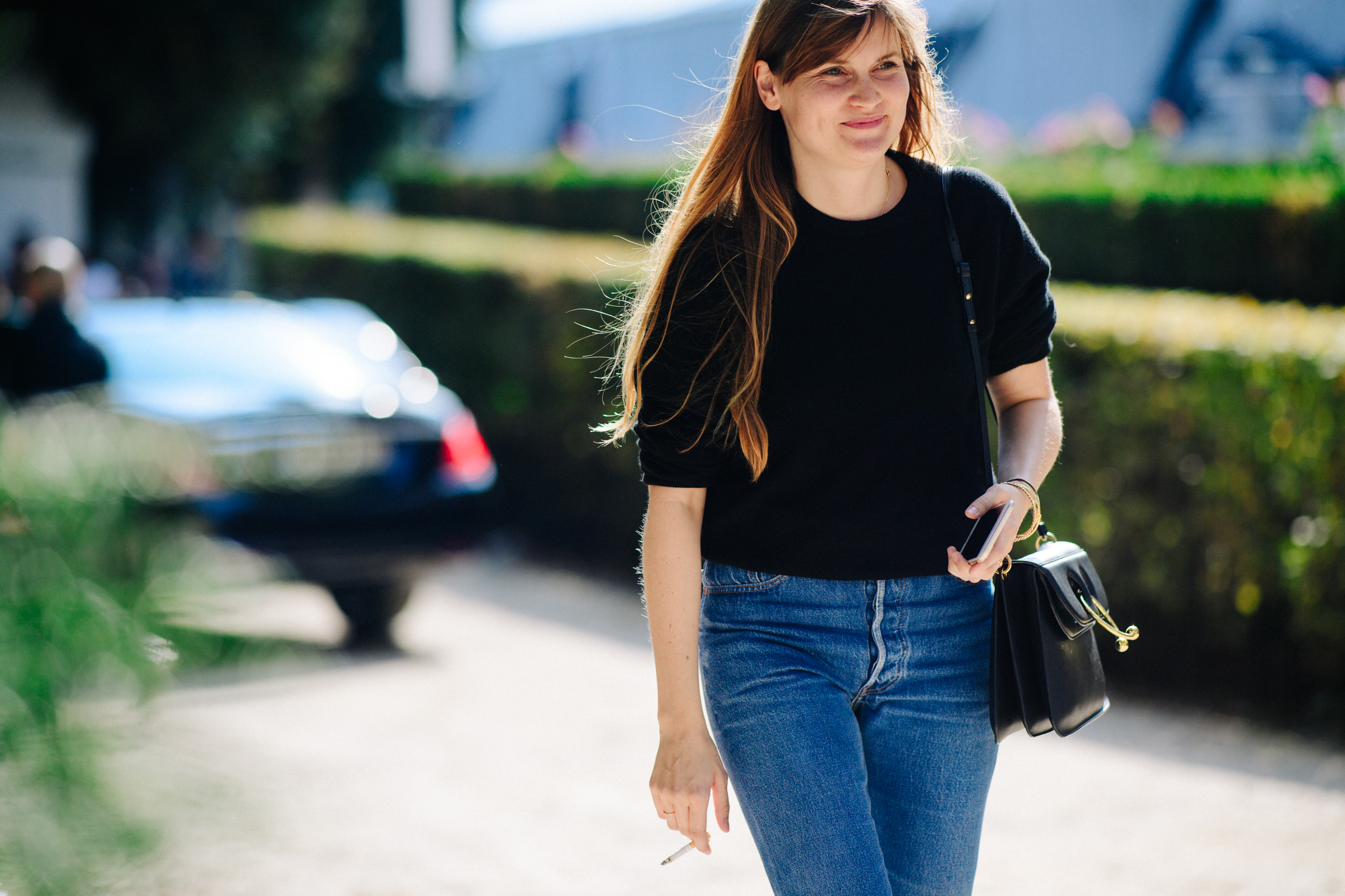 Woman wearing jeans and black t-shirt