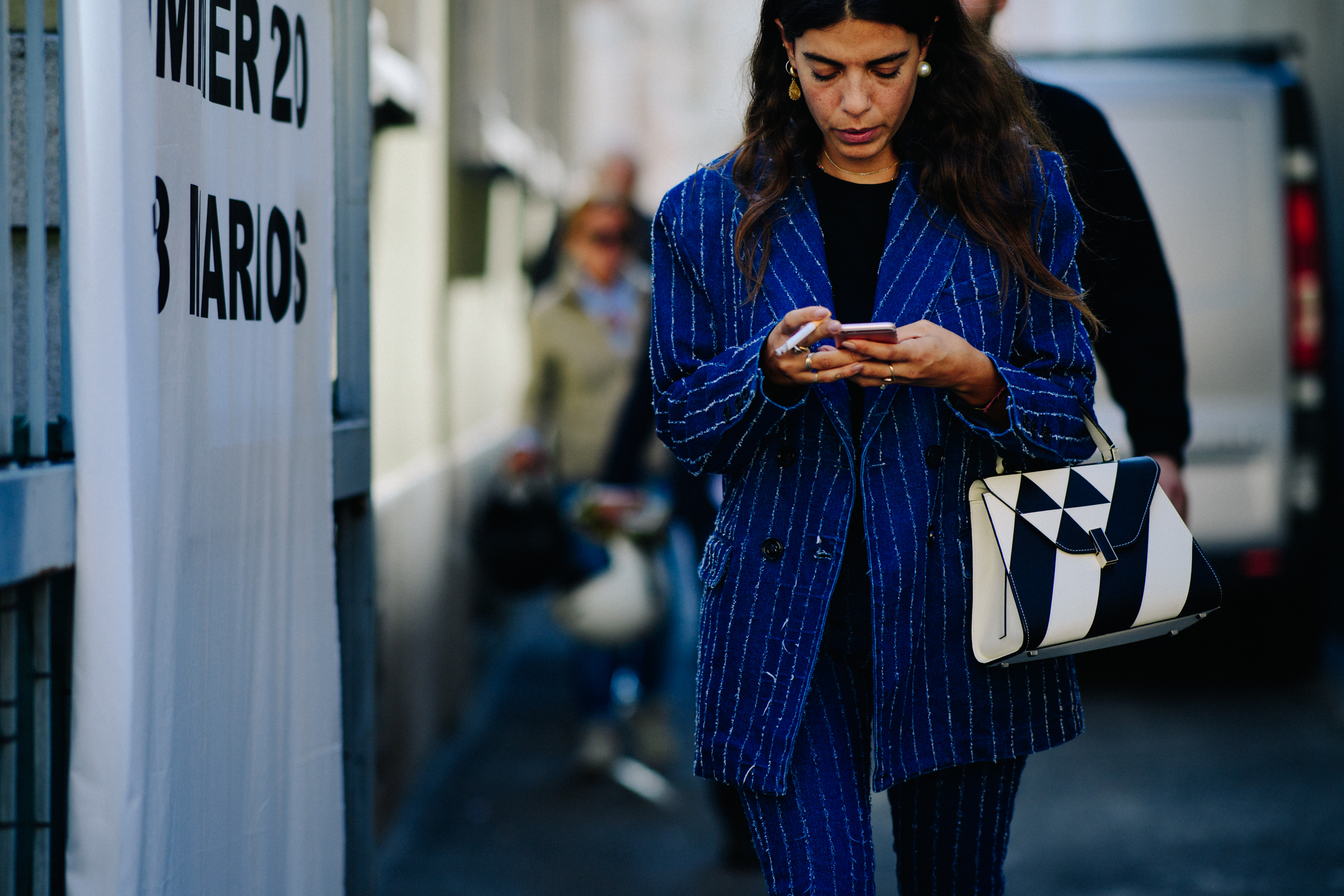 Woman walking in blue striped outfit