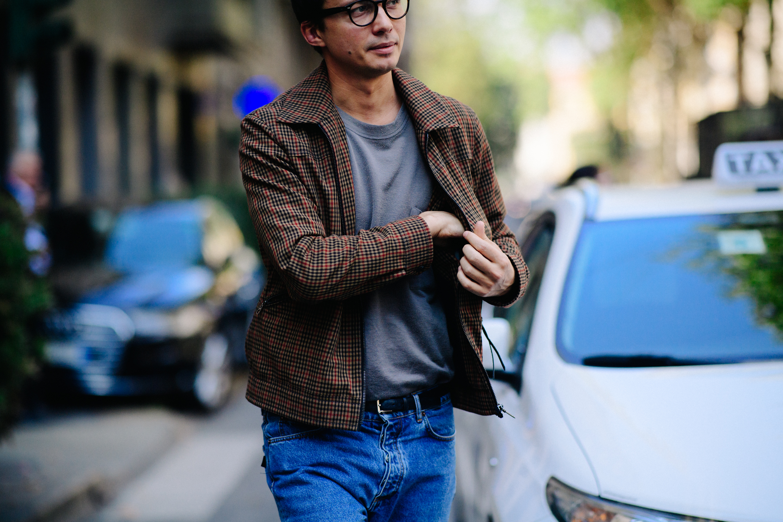Russian photographer wearing brown jacket