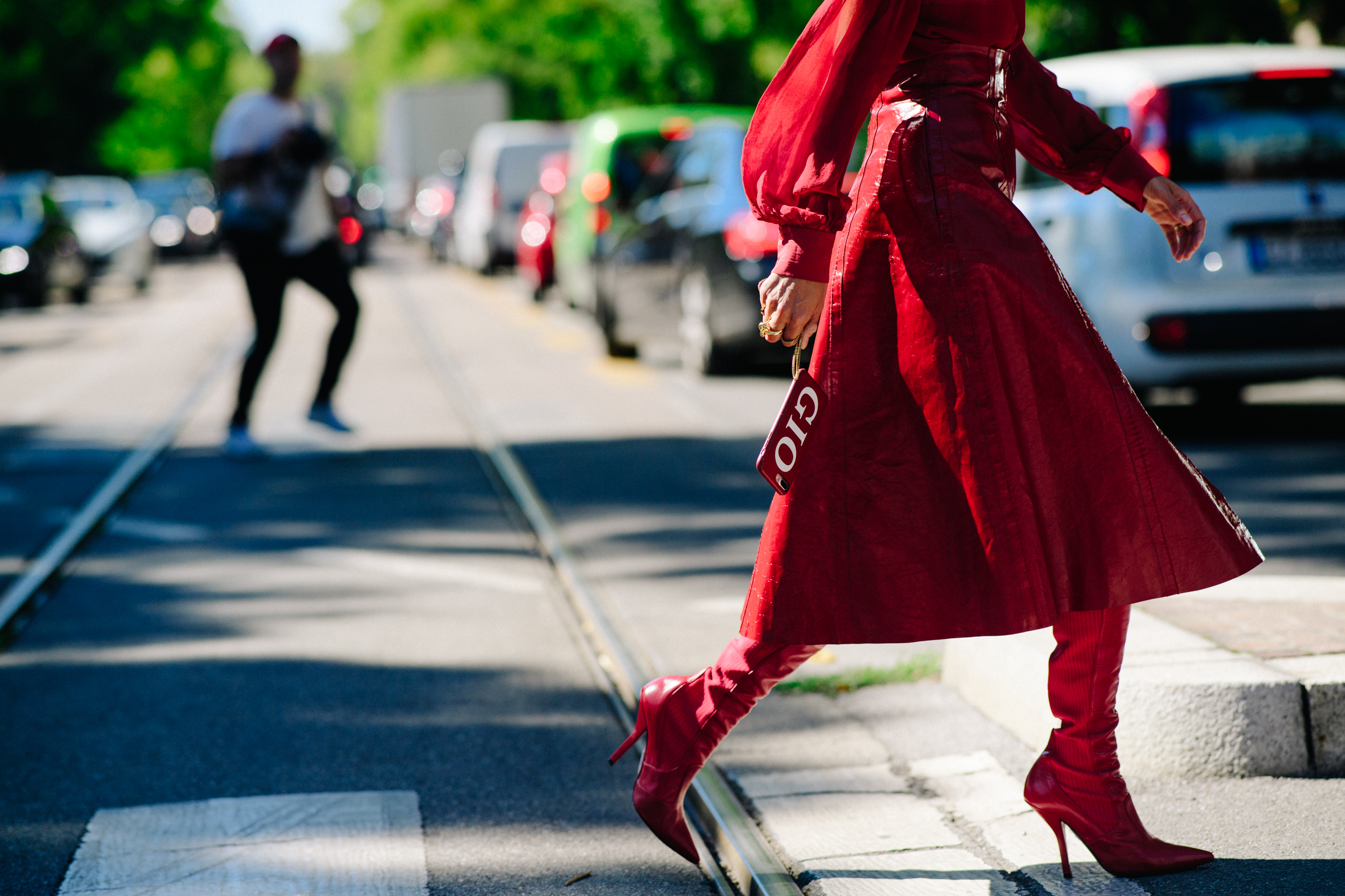 Closeup of woman in red boots and dress