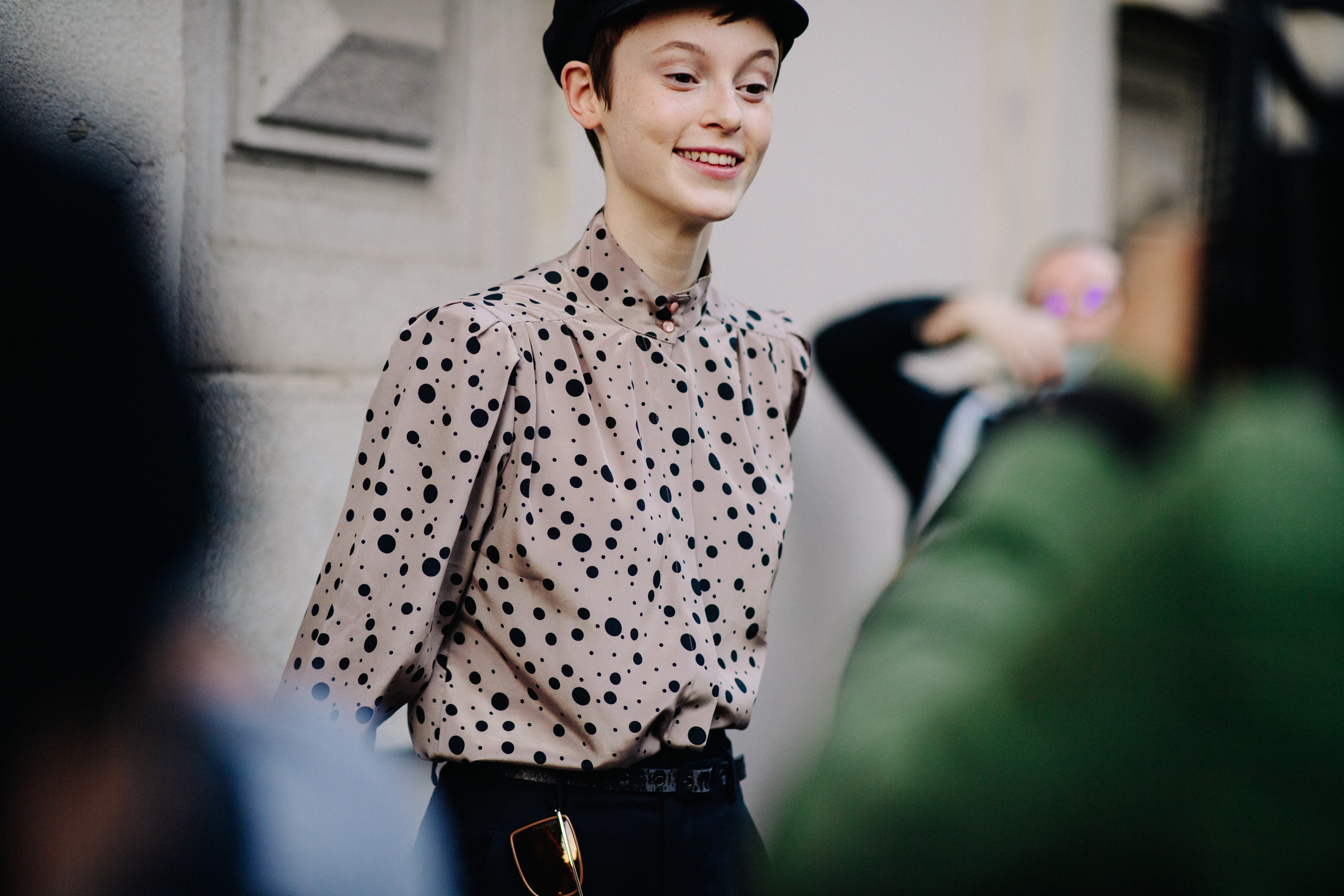 Model wearing spotted top
