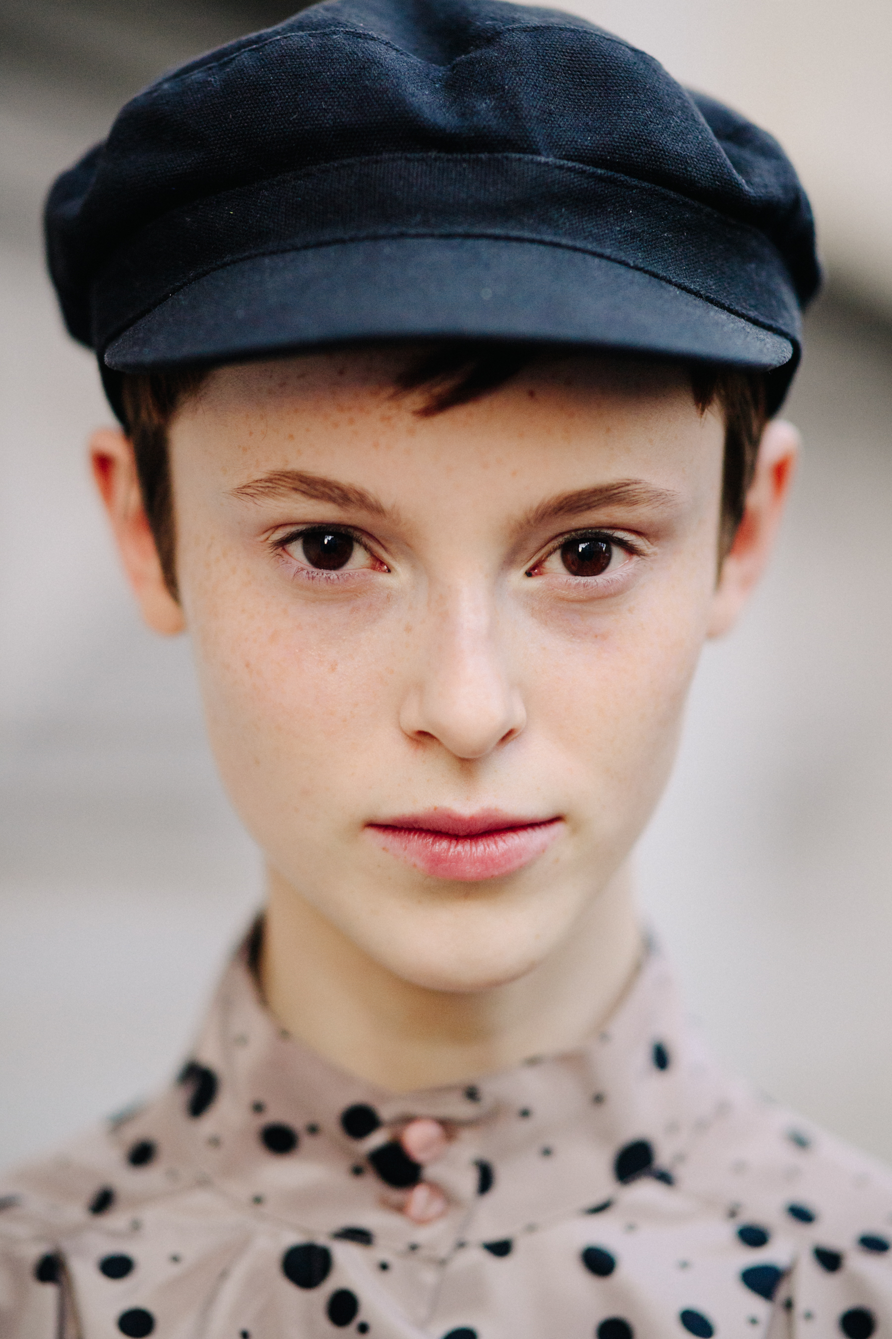 Portrait of model wearing black cap