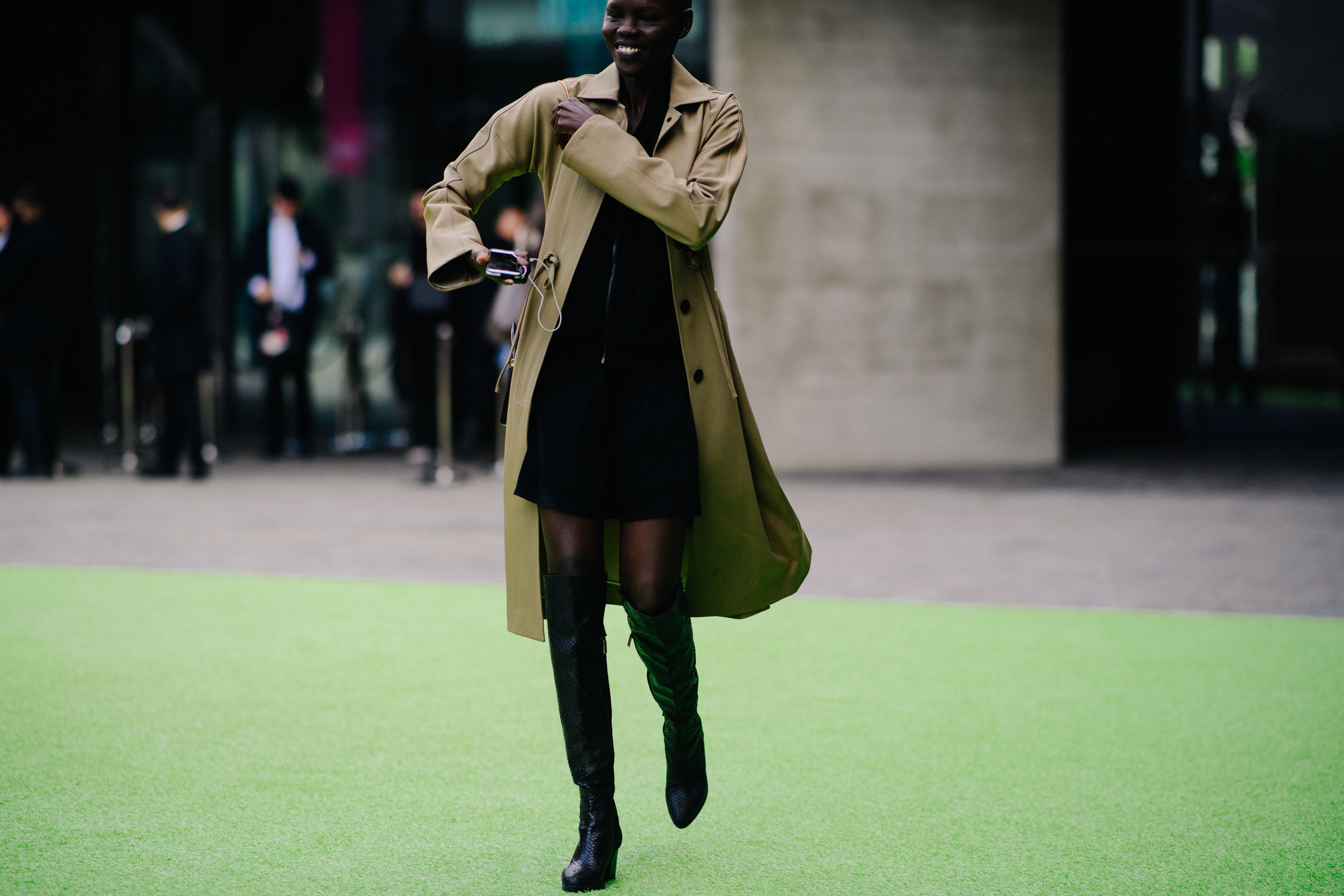 Sudanese model wearing beige coat