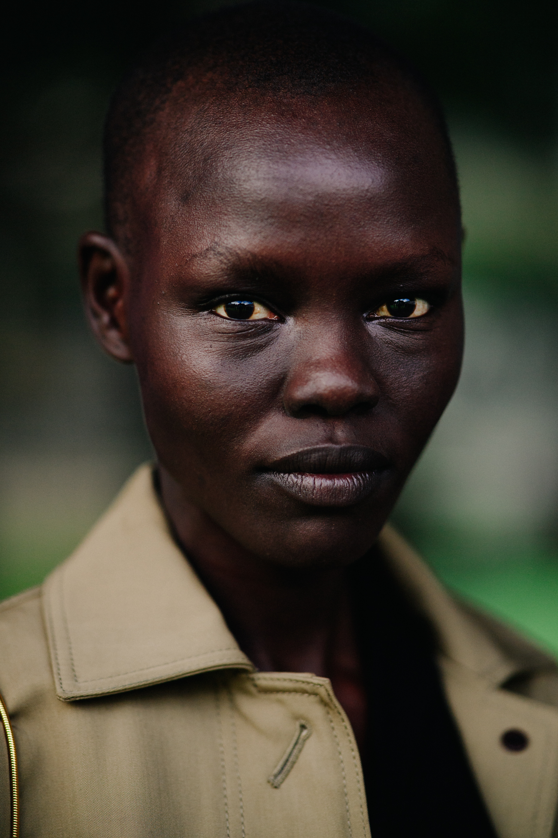 Sudanese model wearing beige coat