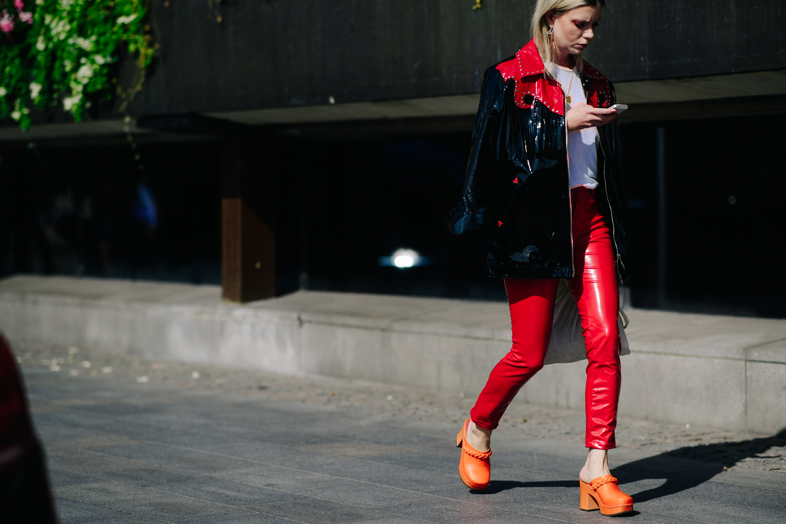Woman wearing red leather pants