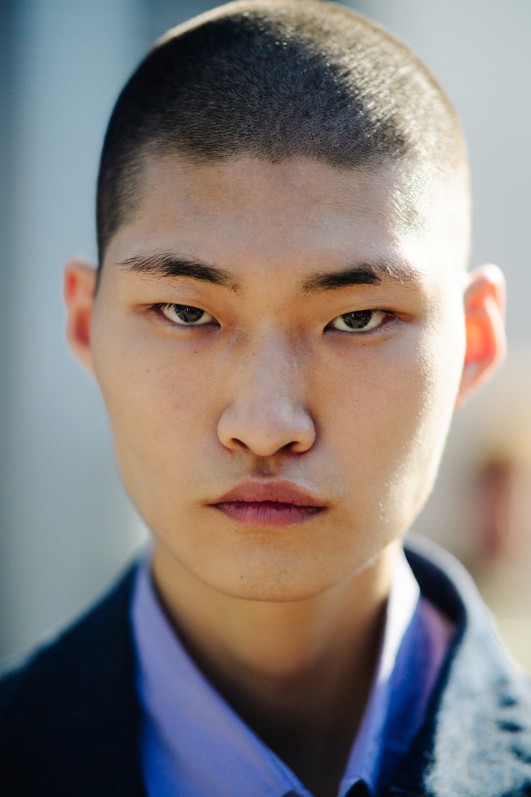 Portrait of Asian model with shaved head