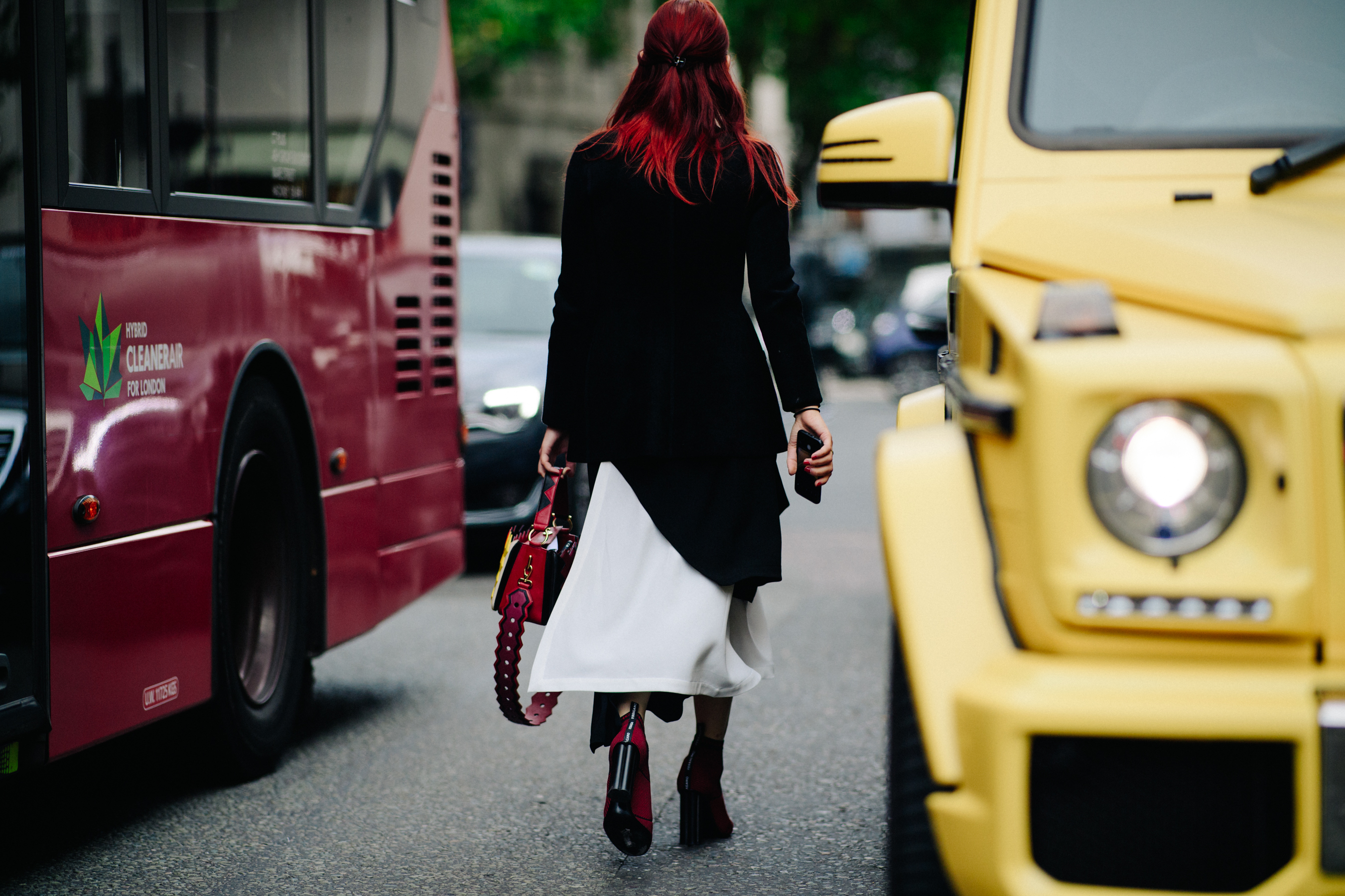 Woman with red hair wearing matching shoes