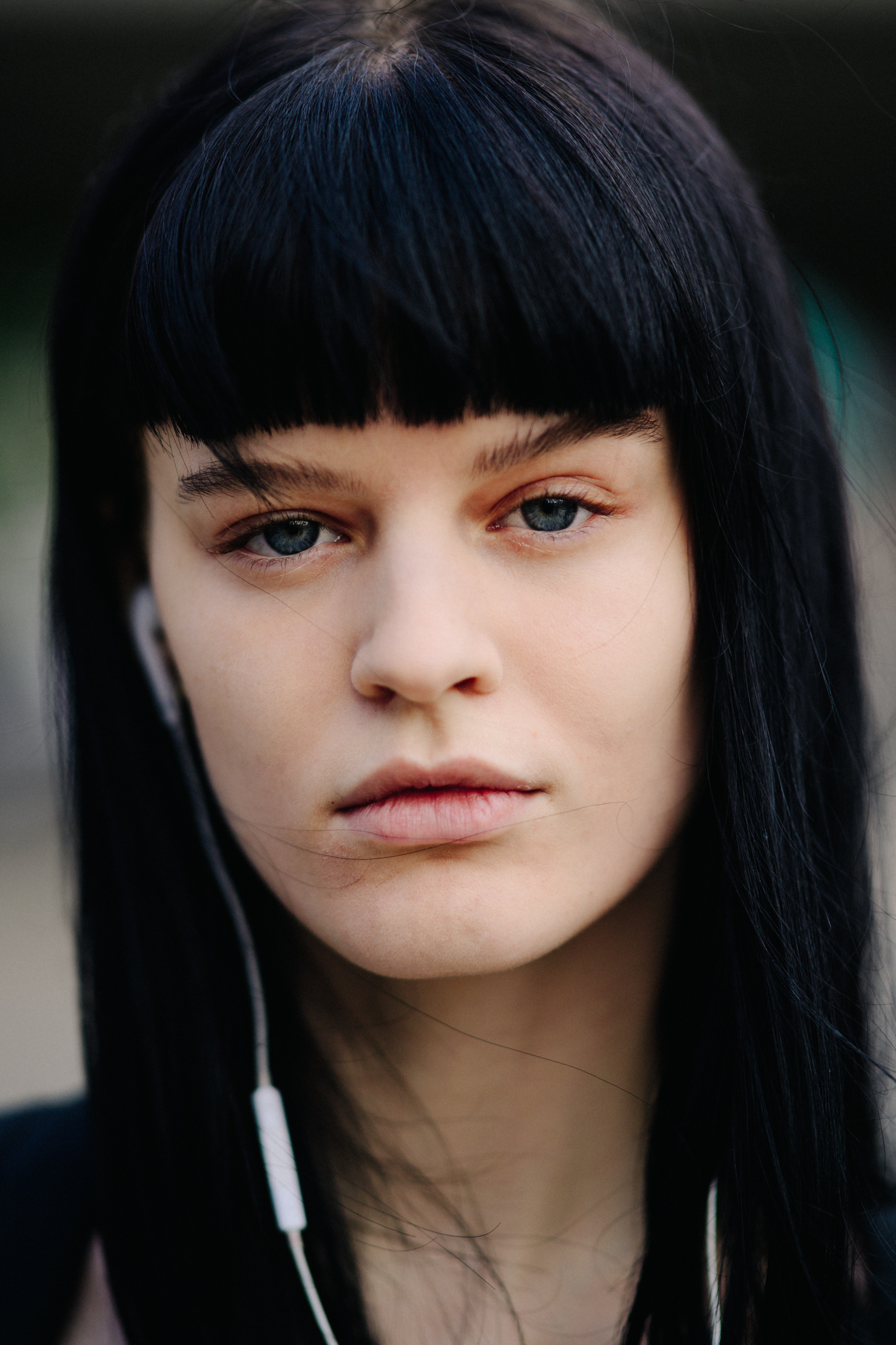 Model with dark hair and bangs