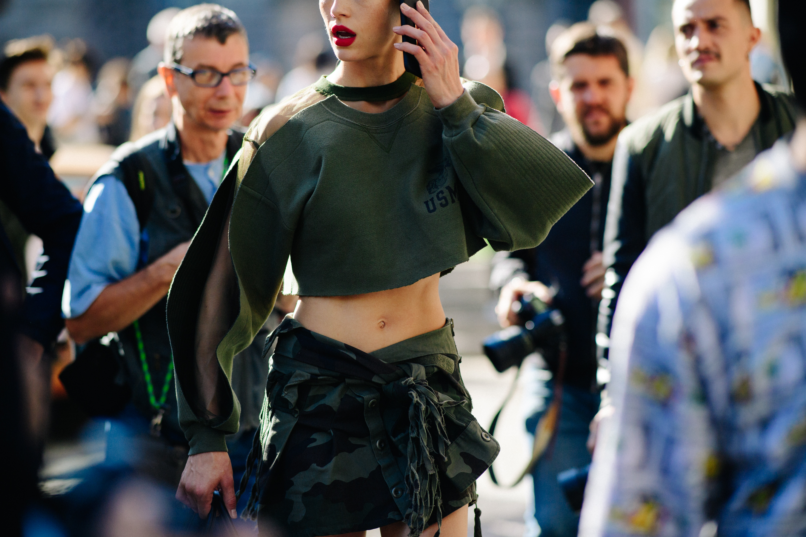 Model wearing green crop top